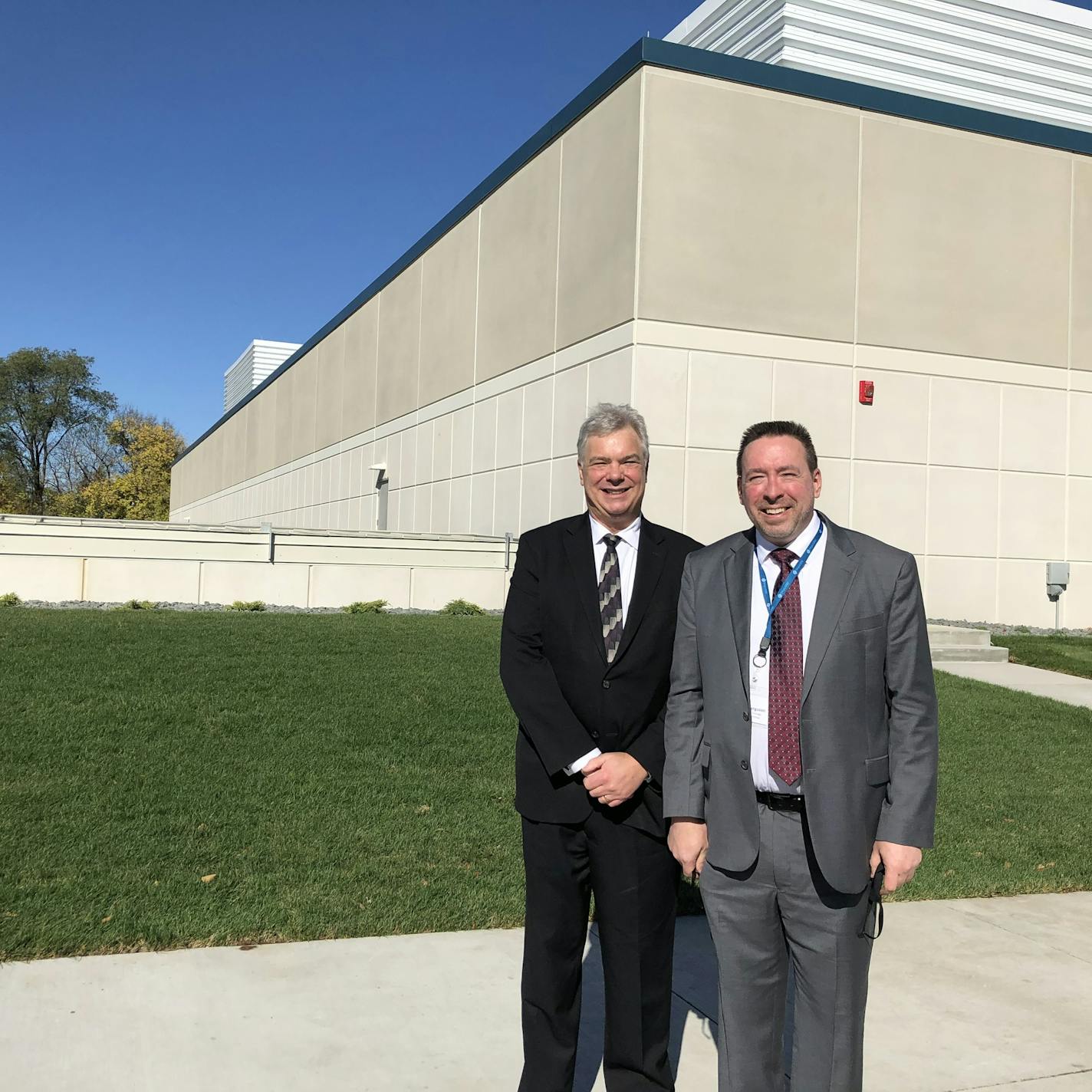 Tom Sonderman, left, chief executive of SkyWater Technology, and Brad Ferguson, the company's chief technology officer, stand in front of the company's newly-completed clean room, a football field-sized space where production will begin in 2021.