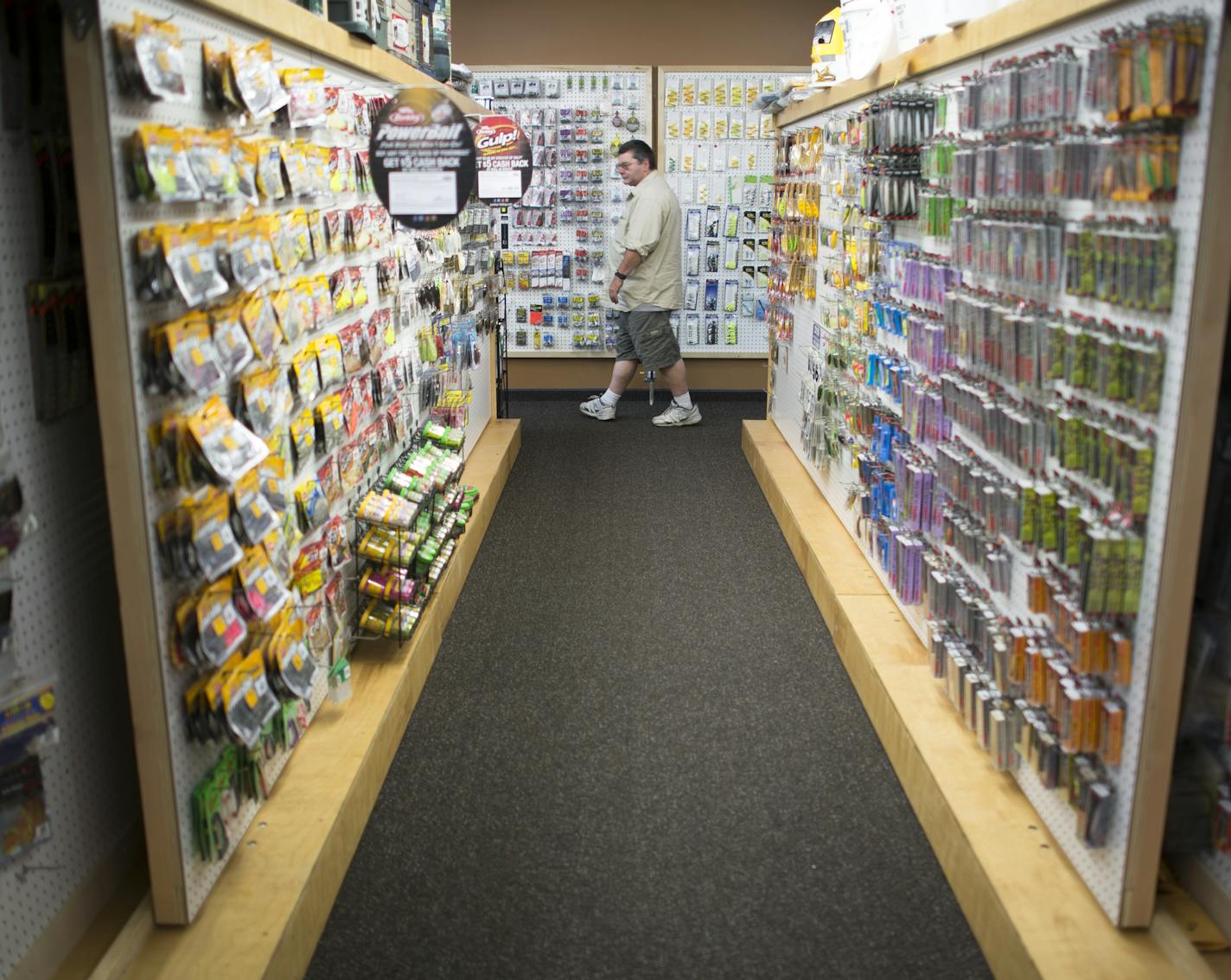 Todd Dugas, of Ramsey, browsed for fly fishing gear while visiting Mike's Bait on 8 Saturday afternoon. ] Aaron Lavinsky &#x2022; aaron.lavinsky@startribune.com Minnessentials story on Mike's Bait on 8, a locale that provides not only minnows and crawlers, but advice, success stories and community. The shop was photographed Saturday, May 23, 2015 in Forest Lake Park.