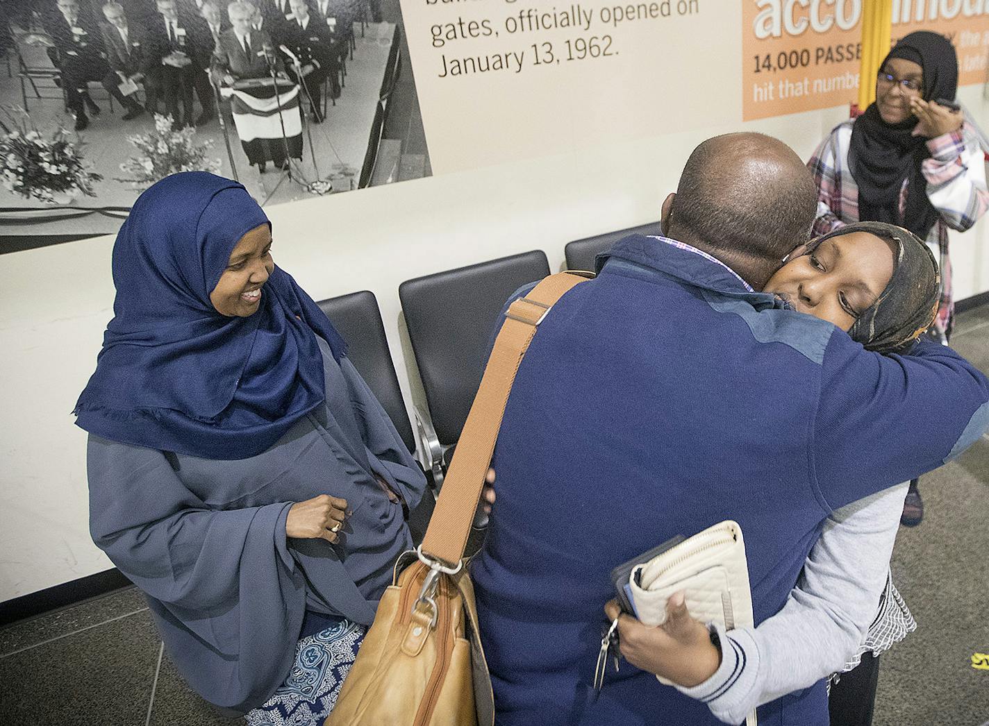 Dahir Salad Hassan hugged his daughter Amina Salad as his other daughter, Faduma Salad, right, and his wife, Hakima Huriye, said goodbye before he boarded a plane Friday for a six-month trip to Somalia, where he plans to help with relief efforts.