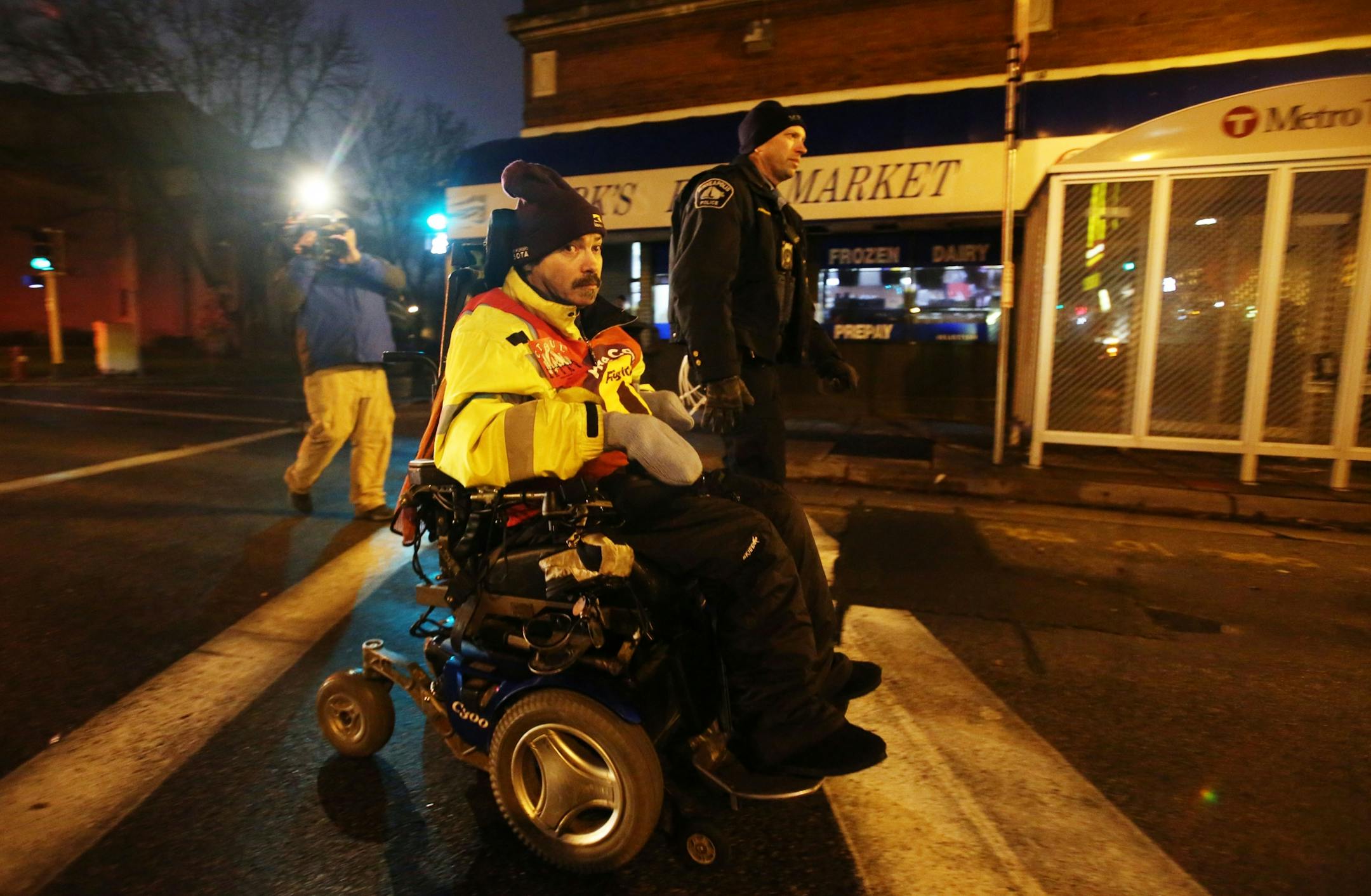 Protestors for Nationwide Fight for $15 Day of Disruption gathered outside McDonald's at 24th St. E. and Franklin Avenue, where for about a half hour protestors sat in a circle and blocked the intersection until they were arrested by Minneapolis police Tuesday, Nov. 29, 2016, in Minneapolis, MN. Here, Darrell Paulsen of Maplewood was the last of the protestors taken into police custody after protestors sat and blocked the intersection. Those arrested were ticketed and released.