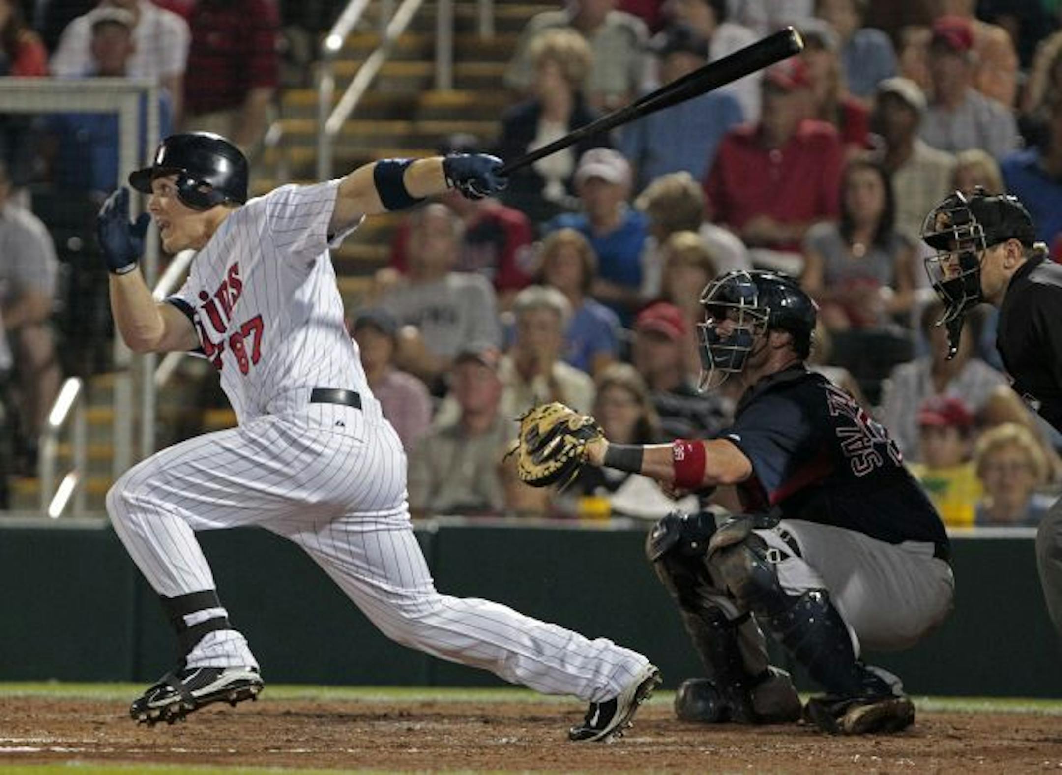 Minnesota Twins outfielder Joe Benson hits a three-run triple against Boston Red Sox pitcher Hideki Okajima in the fifth inning of their Grapefruit League spring training season opening baseball game at Hammond Stadium in Fort Myers, Fla., Sunday, Feb. 27, 2011. Catching for Boston is Jarrod Saltalamacchia.