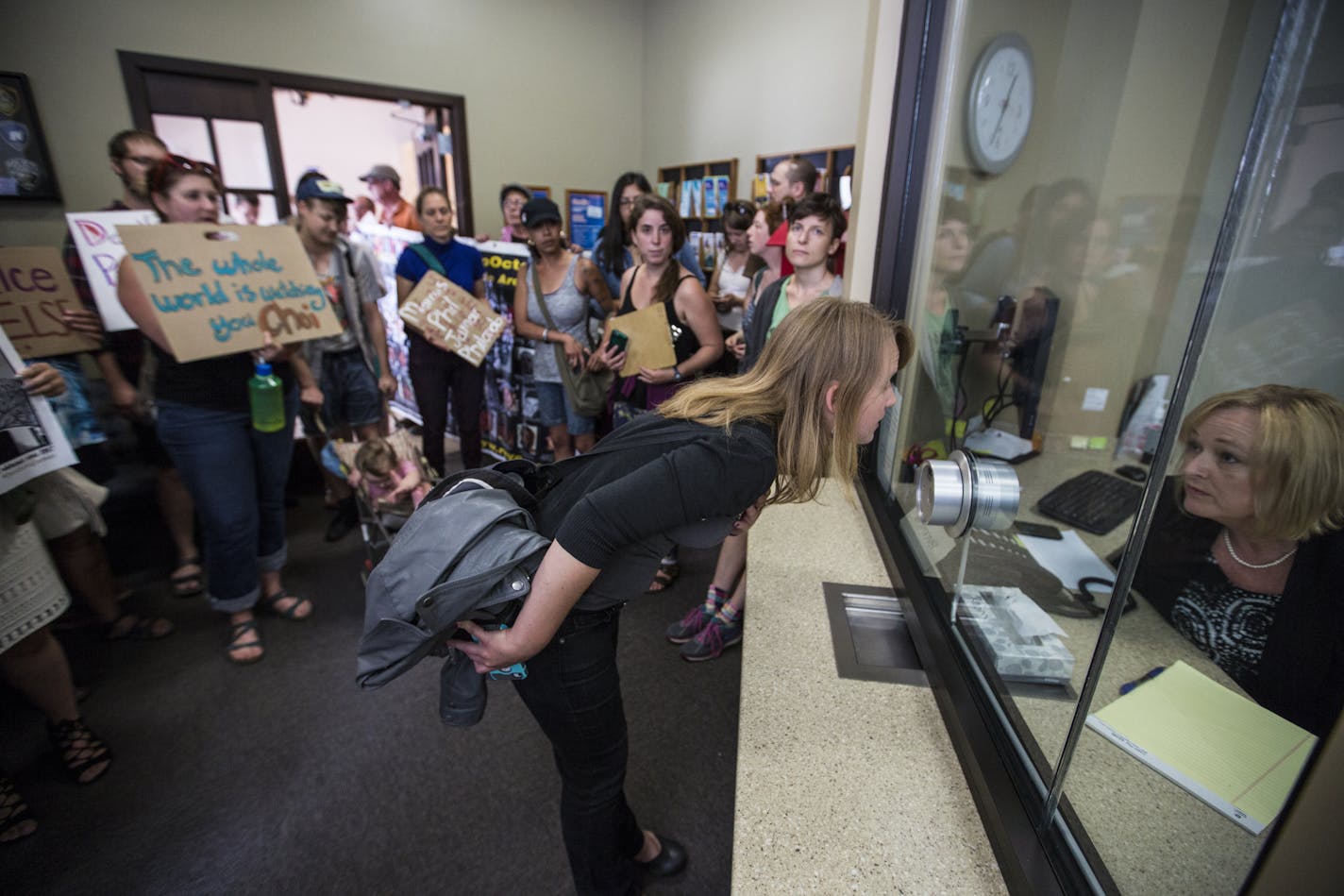 Sophia Hansen-Day, with the Twin Cities Coalition for Justice for Jamar, asked Janety Hafner, Director of Support Services and Organizational Development at Ramsey Countym, to speak to Ramsey County Attorney John Choi at the Ramsey County Attorney's Office in downtown St. Paul, Minn., on Friday, July 15, 2016. The crowd was told he was unavailable and was in a meeting dealing with the subject of the Philando Castile shooting. ] RENEE JONES SCHNEIDER &#x2022; reneejones@startribune.com