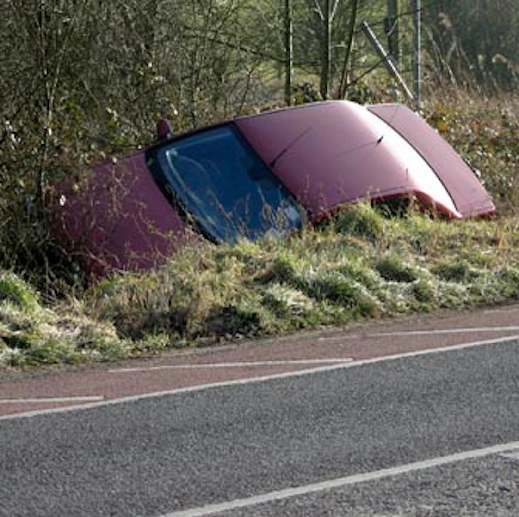An actual car, in an actual ditch. No alligators. No Slurpees.