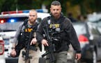 Law enforcement personnel at the scene of a mass shooting at the Tree of Life synagogue in Pittsburgh, Oct. 27, 2018. At least four people were dead a
