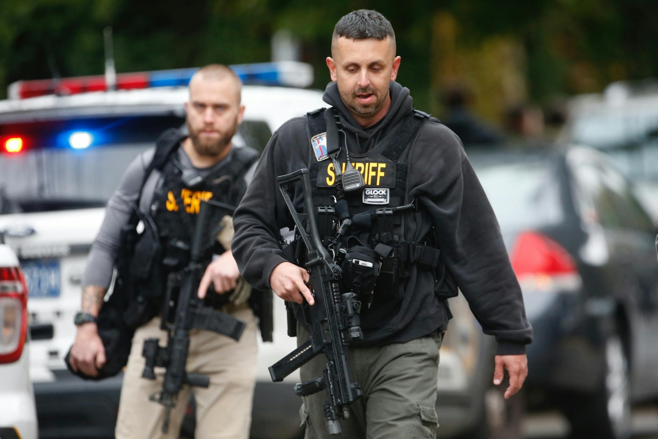 Law enforcement personnel at the scene of a mass shooting at the Tree of Life synagogue in Pittsburgh, Oct. 27, 2018. At least four people were dead and six injured after a gunman opened fire during a service here; police say a suspect, Robert Bowers, is in custody, and the attack is being treated as a hate crime.