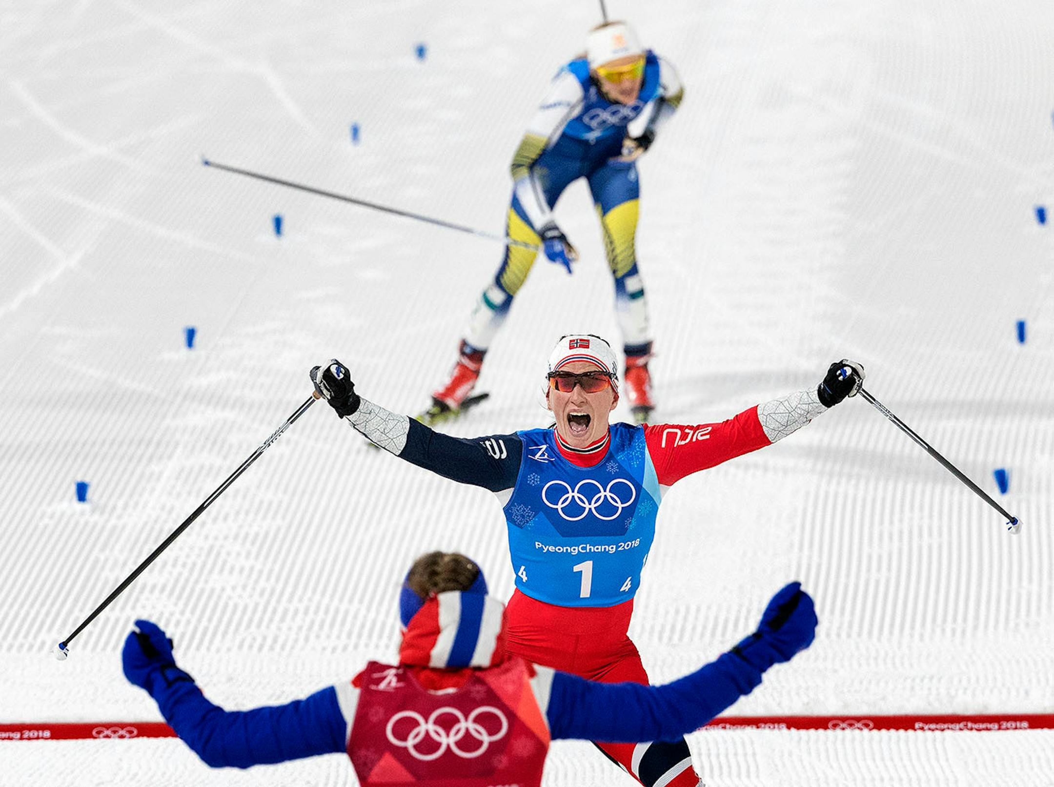Marit Bjoergen of Norway celebrated after crossing the finish line. Norway won the gold medal in the Women's 4x5km Relay at Alpensia Cross-Country Centre.