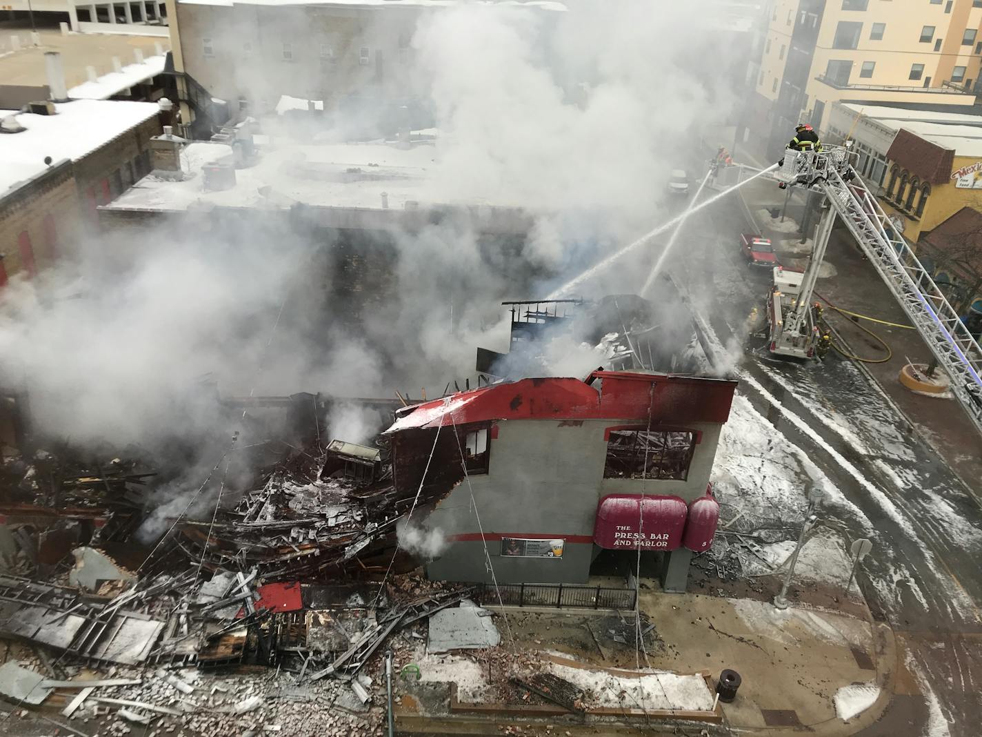 Firefighters battled a blaze at the Press Bar and Parlor in St. Cloud.