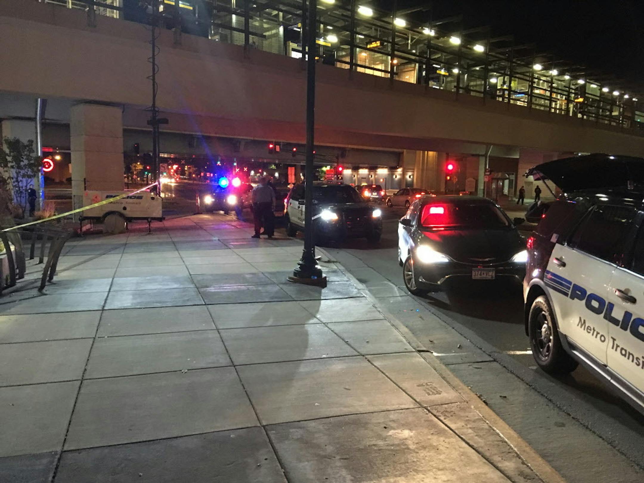 ID1004674703 Caption:
Minneapolis Police Department officers surveyed a crime scene Tuesday [Oct. 3] beneath the LRT station on E. Lake Street in Minneapolis. A man was fatally stabbed there about 7:15 p.m. Photo by Libor Jany.