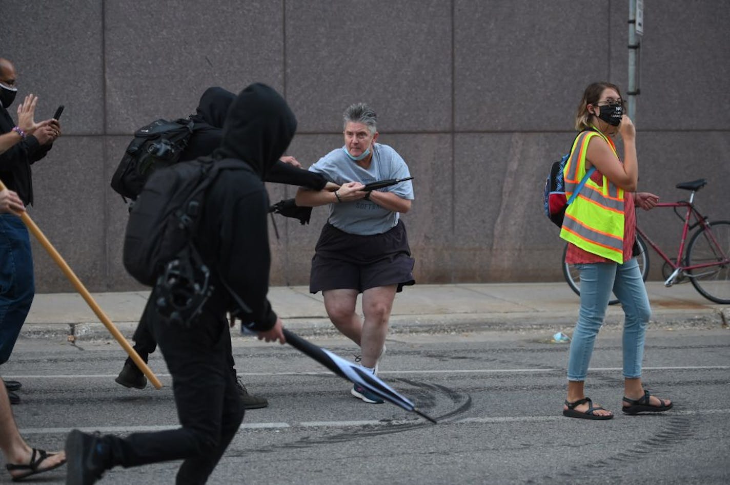 Up to 200 people gathered Thursday evening outside the federal courthouse in downtown Minneapolis to protest the lack of charges in Breonna TaylorÕs March shooting death in Kentucky. There was a least one heated confrontation between a protester and a motorist and protesters at one point tried to tear down a fence in front of the building, a witness said.