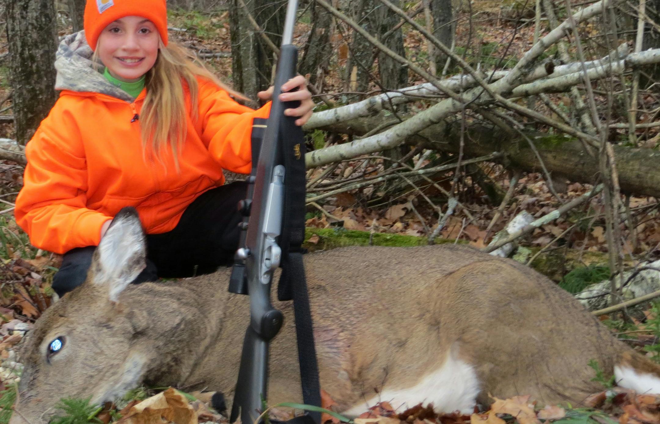 Ali Hygrel, 10, of Maple Lake, with her first-ever deer, which she bagged this fall.