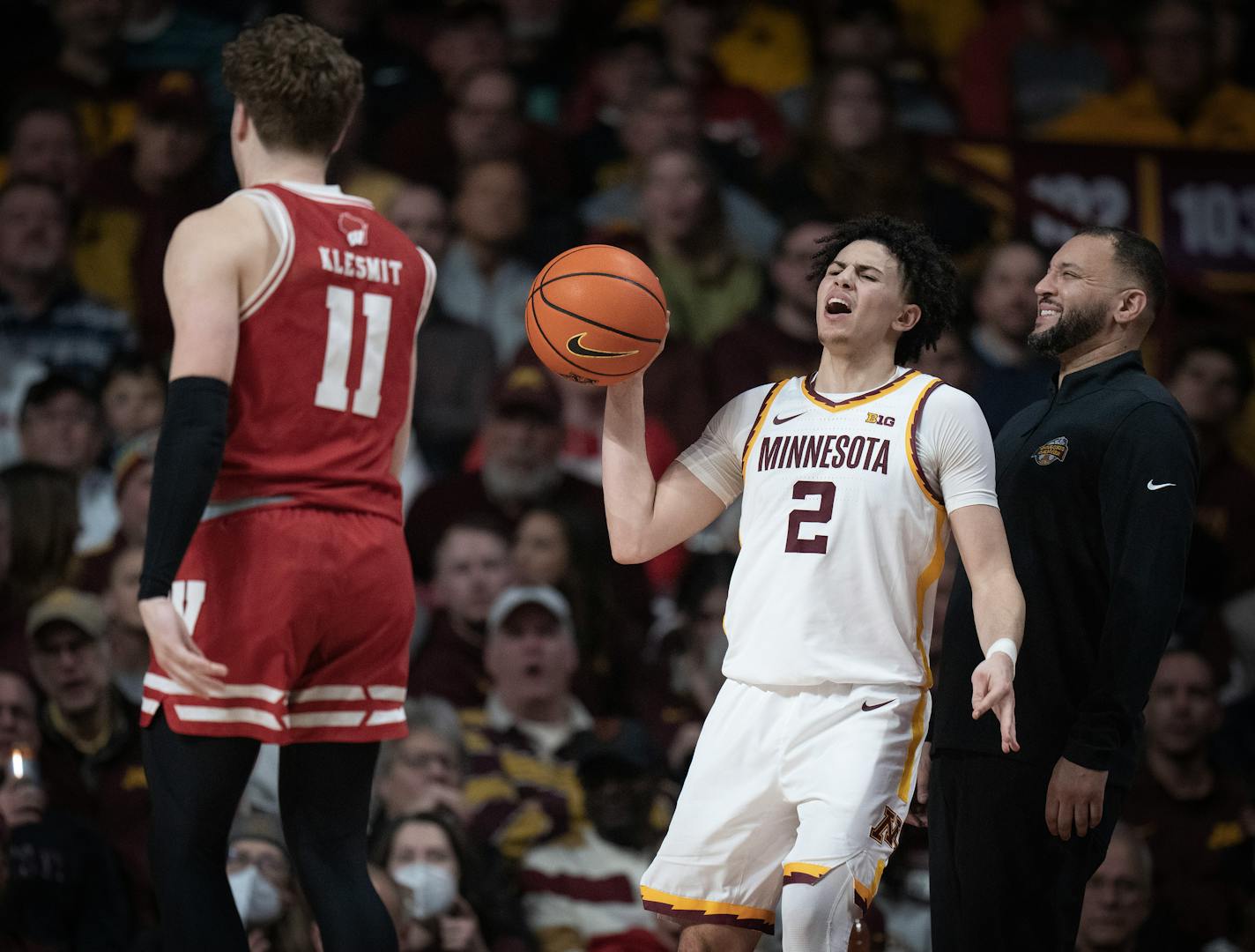 Gophers guard Mike Mitchell Jr. (2) and head coach Ben Johnson react after a Gopher turnover in the second half.