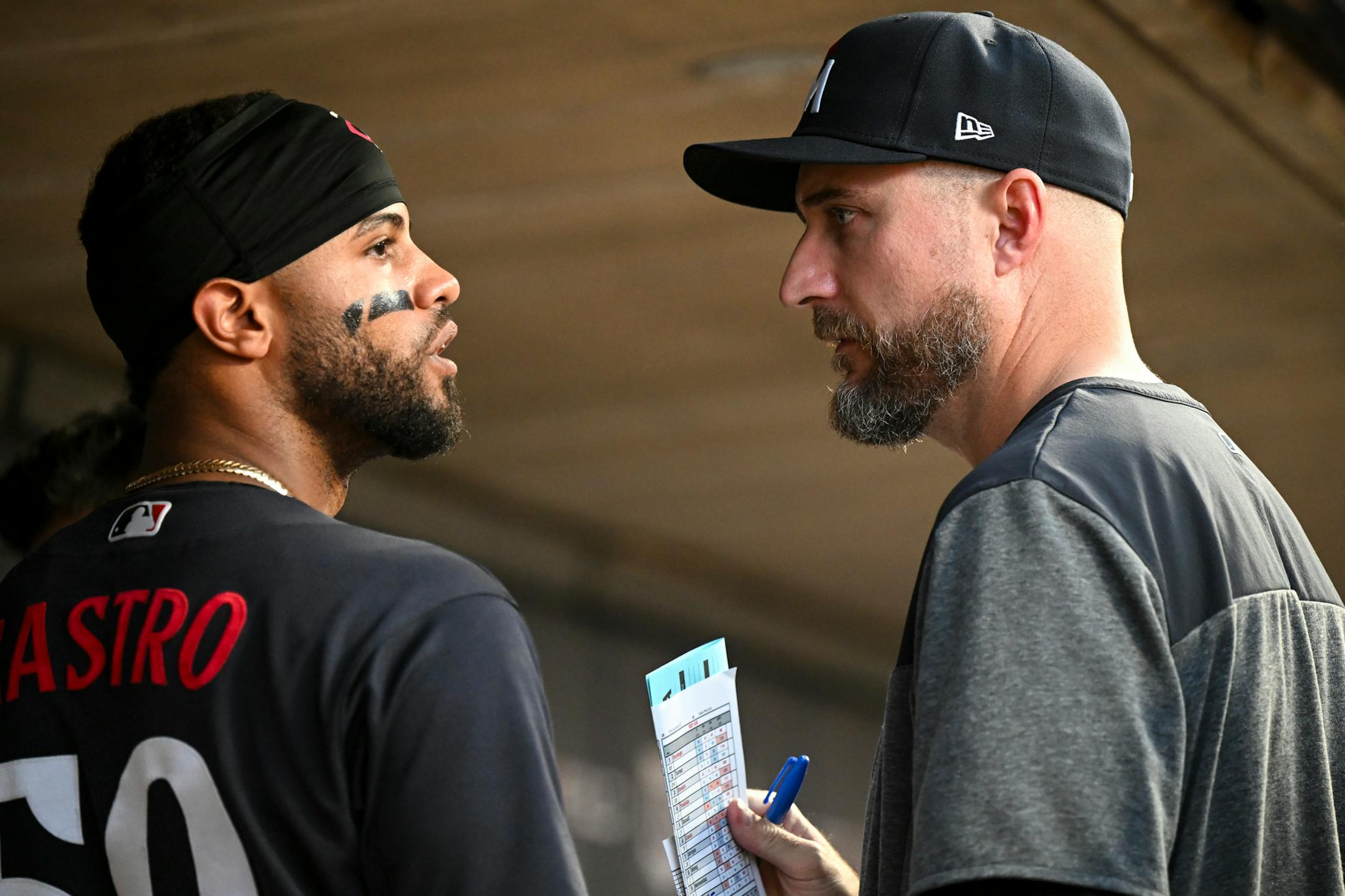 Minnesota Twins manager Rocco Baldelli (5) talks with center fielder Willi Castro (50) moments before Castro was sent in to pitch in the ninth inning against the Boston Red Sox Tuesday, June 20, 2023, at Target Field in Minneapolis, Minn.