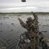 Doug Smith/Star Tribune Dan Kirchner of Mankato tosses decoys out for the duck opener Saturday on Swan Lake.