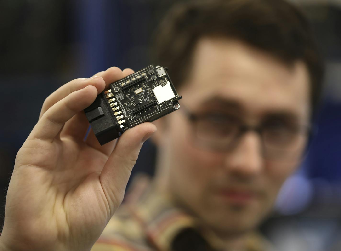 Earl Sharpe holds the Macchina M2 open source automotive interface. ] JEFF WHEELER &#xef; jeff.wheeler@startribune.com Minnesota cousins and entrepreneurs Earl and Josh Sharpe are developing a device that will help people tinker with their cars. Industry veterans see it as a meaningful development for the car hacking community. The Sharpe's showed their interface at Modern Automotive Performance, a high performance shop in Cottage Grove Thursday afternoon, May 18, 2017.