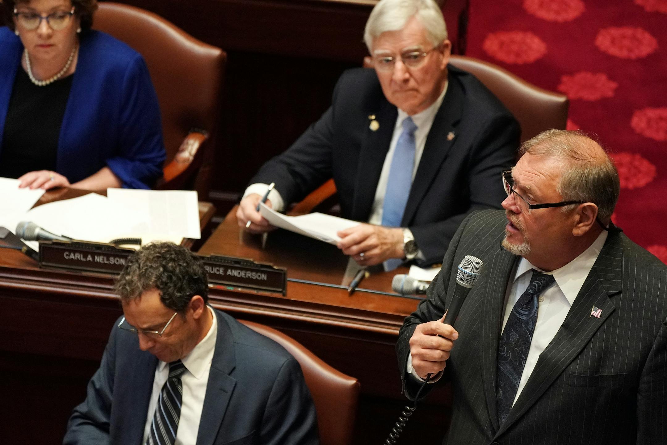 Senate Minority Leader Sen. Tom Bakk (DFL-Cook), right, spoke in the Senate Chamber on the first day of the legislative session.
