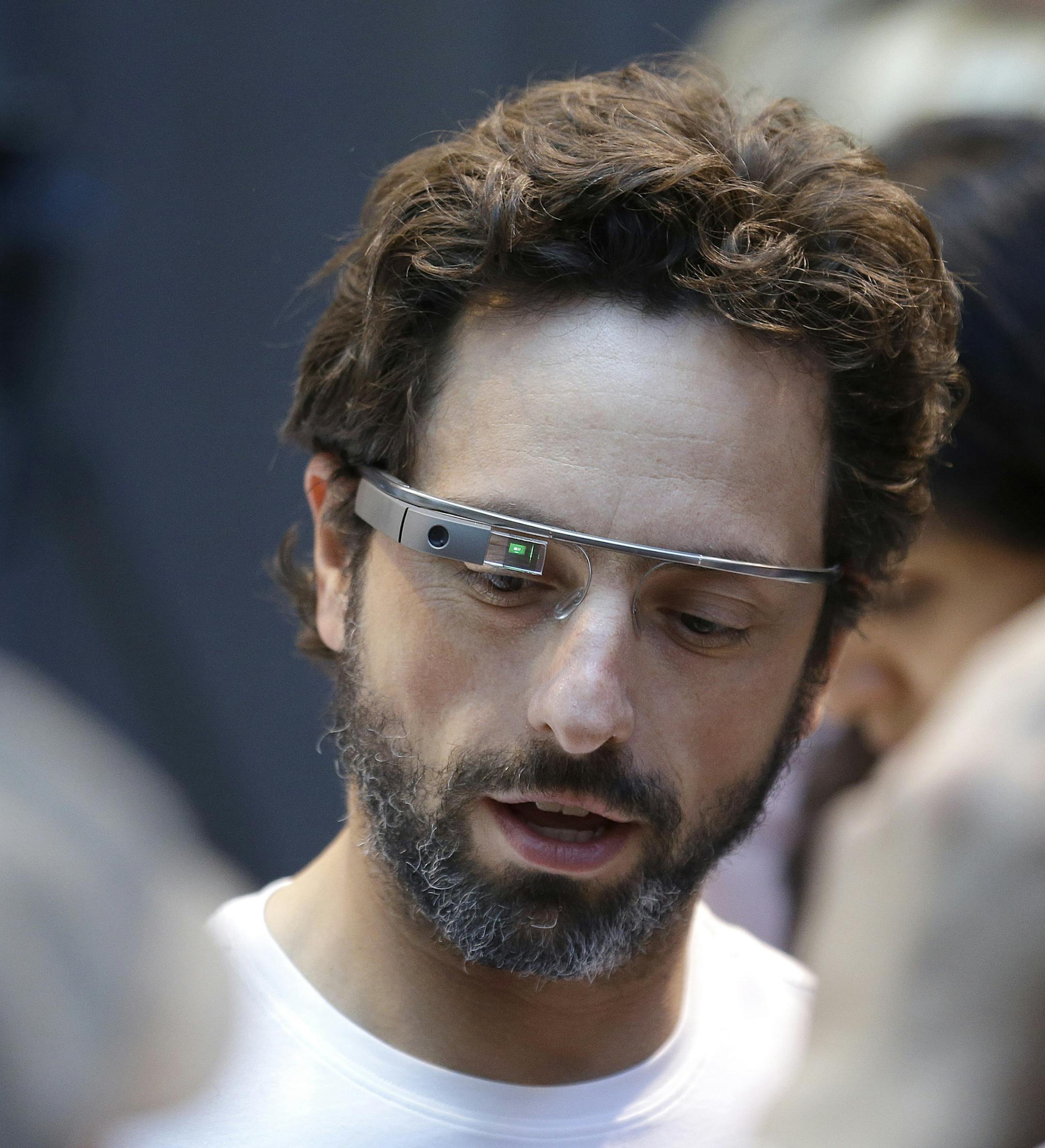 Google co-rounder Sergey Brin wears Google Glass glasses at an announcement for the Breakthrough Prize in Life Sciences at Genentech Hall on UCSF&#xed;s Mission Bay campus in San Francisco, Wednesday, Feb. 20, 2013. Google is giving more people a chance to pay $1,500 for a pair of the Internet-connected glasses that the company is touting as the next breakthrough in mobile computing. The product, dubbed "Google Glass," will be offered to "bold, creative individuals" selected as part of a contest
