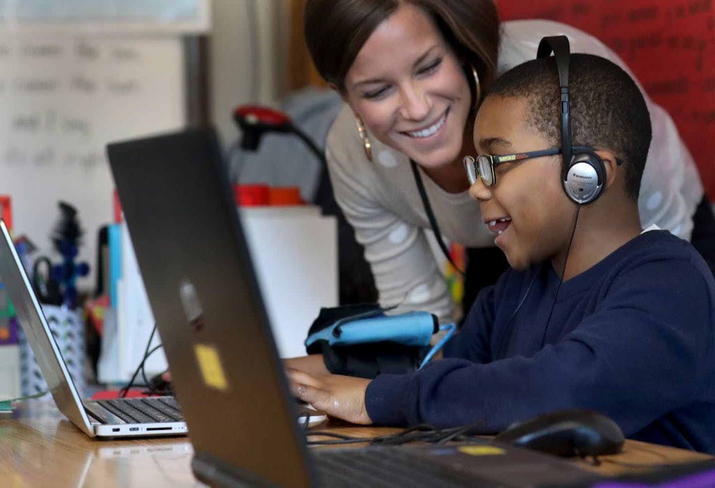 Emerson Spanish Immersion student Tayvin Stoll works after school on NASA-inspired computer games by Play Attention, powered by sensors reading one's brain waves, on Thursday, Jan. 17, 2019, in Minneapolis, MN. Looking on is second-grade teacher Brianna Jensen, the program's creator.