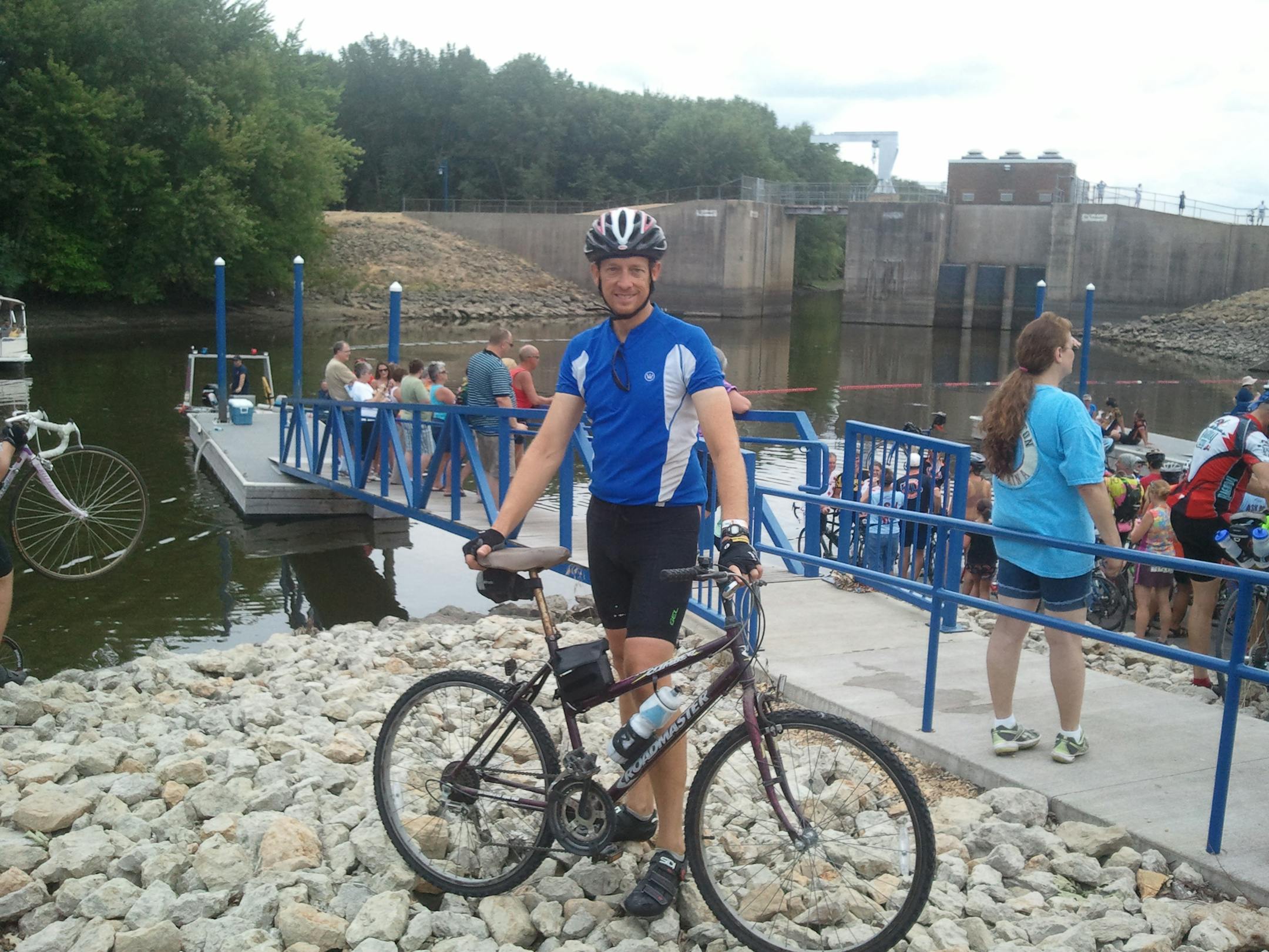 Scott Sponheim made it to the Mississippi River by riding a girls bicycle for most of the final leg in his week-long trek across Iowa.