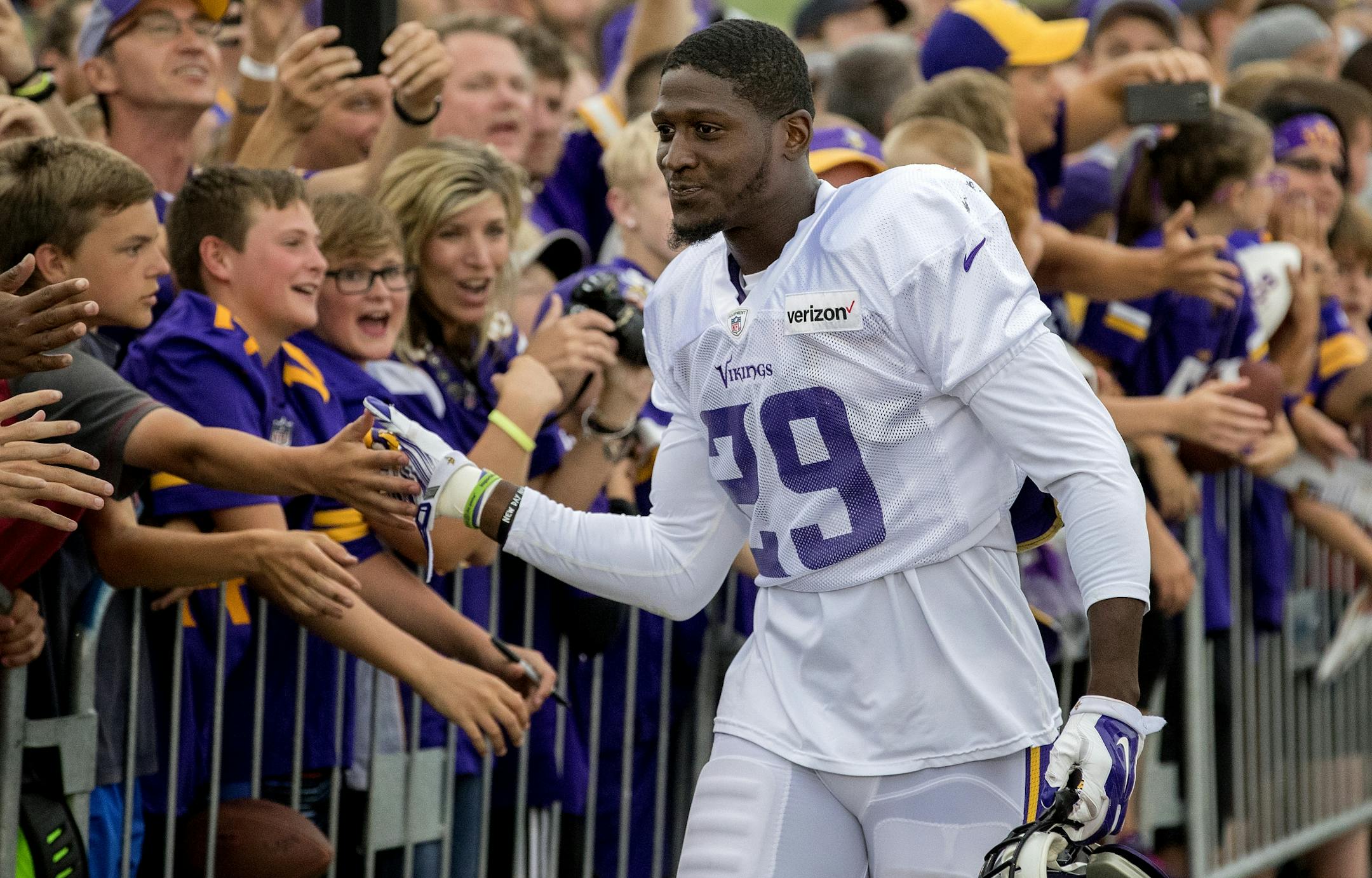 Fans greeted Xavier Rhodes (29) before the scrimmage at Blakeslee Stadium in Mankato.