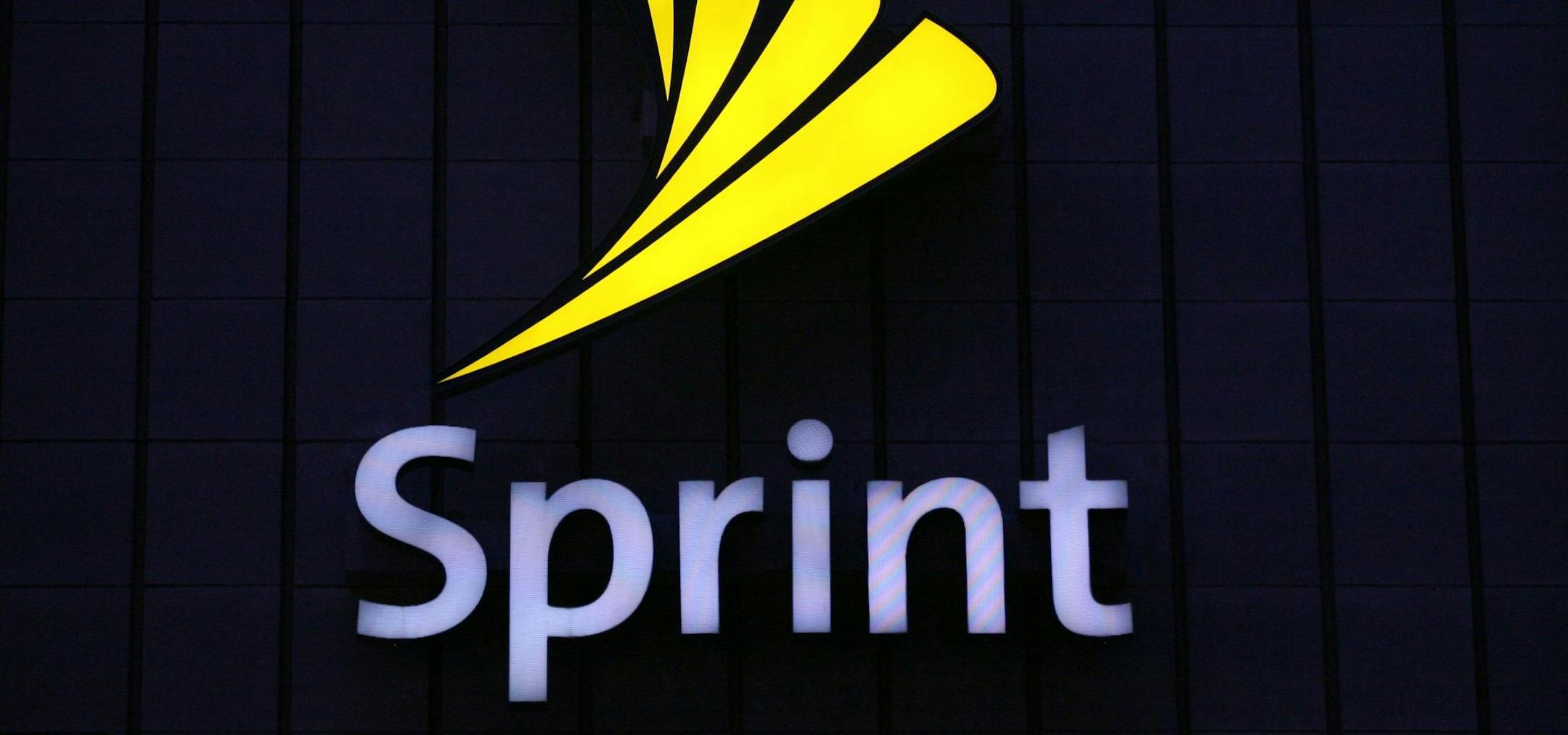 ** FILE ** In this Aug. 7, 2008 file photo, an illuminated Sprint sign is shown at one of the company's stores in New York. Sprint Nextel Corp. is eliminating about 8,000 positions in the first quarter, it was announced Monday, Jan. 26, 2009, as it seeks to cut annual costs by $1.2 billion. (AP Photo/Mark Lennihan, File) ORG XMIT: NYML402