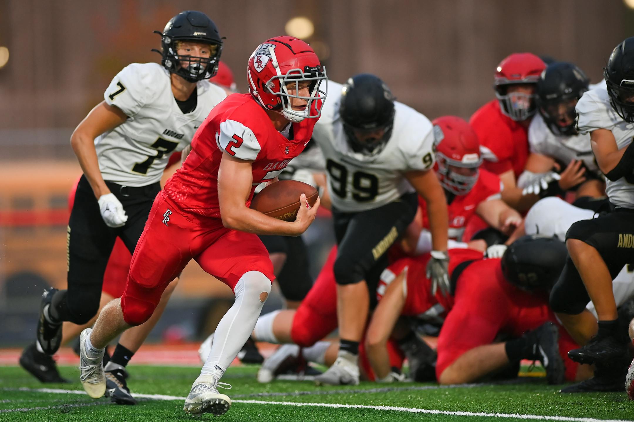Elk River quarterback Cade Osterman (2) rushes the ball Friday, Sept. 9, 2022 during the first half of a football game at Elk River High School in Elk River, Minn. ] aaron.lavinsky@startribune.com ORG XMIT: MIN2209092039370124
