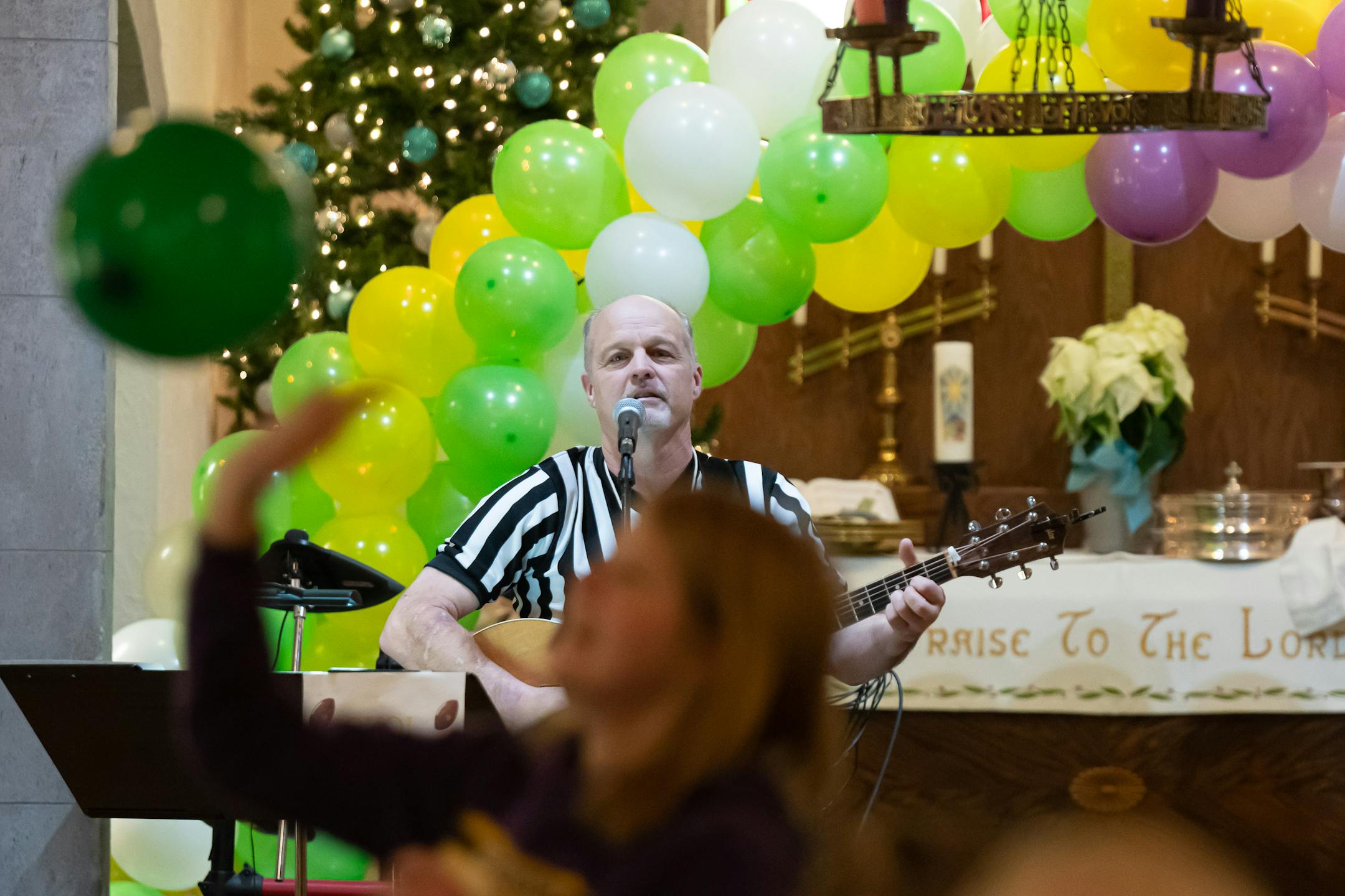 Parishoners launched purple, green and yellow balloons toward the end of the service as musical director Steve Berggren sang.