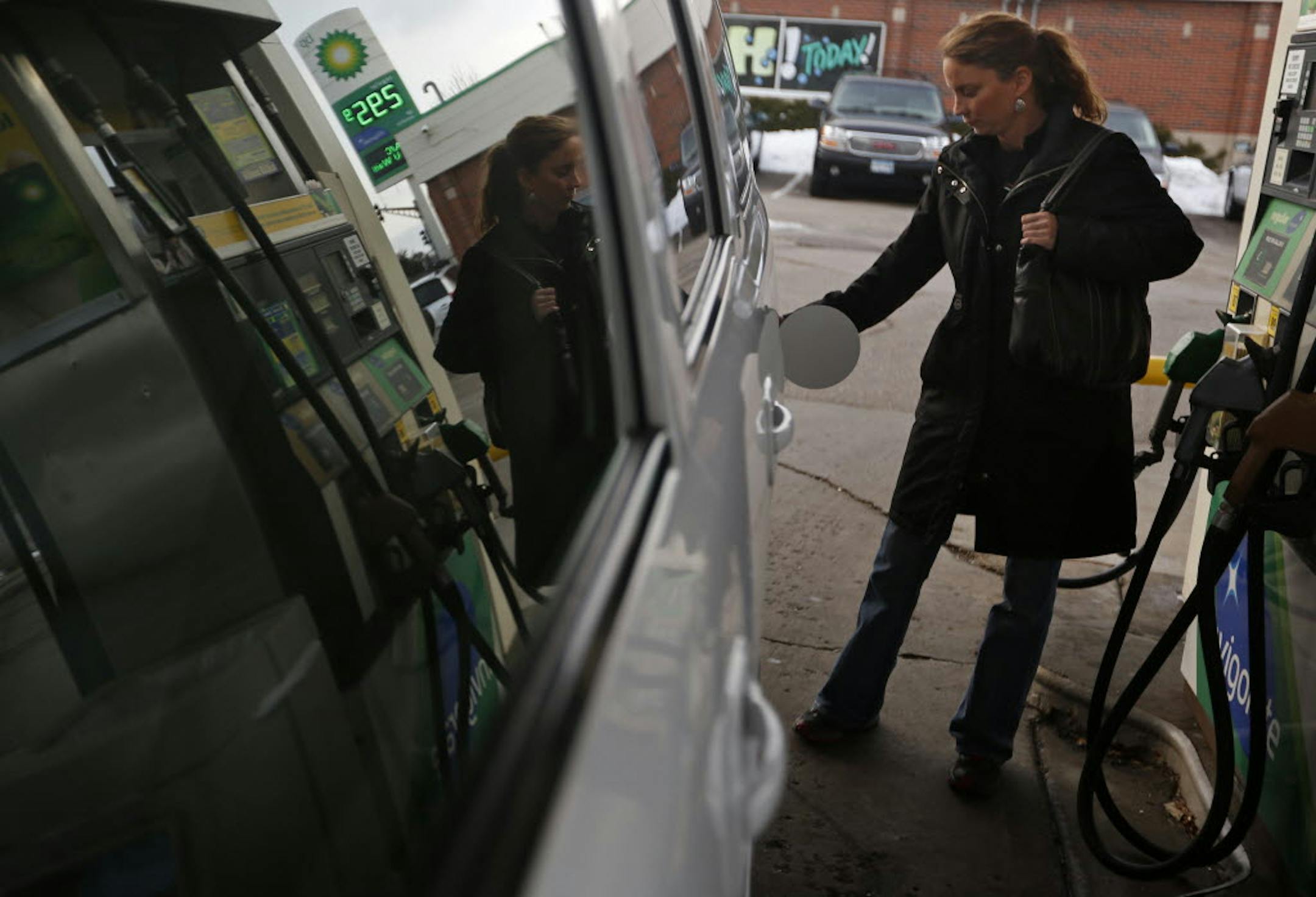 Katie Langseth of Eden Prairie filled up at a BP on Burnsville Parkway near Interstate 35W on Wednesday. Regular unleaded was going for $2.95 a gallon.