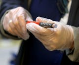 Jolie Holland, left, a Licensed School Nurse in the Howard Lake-Waverly-Winstead School district, prepares an insulin pen for an injection for a young student with diabetes at Winstead Elementary School Wednesday, Sept. 25, 2019, in Winsted, MN.