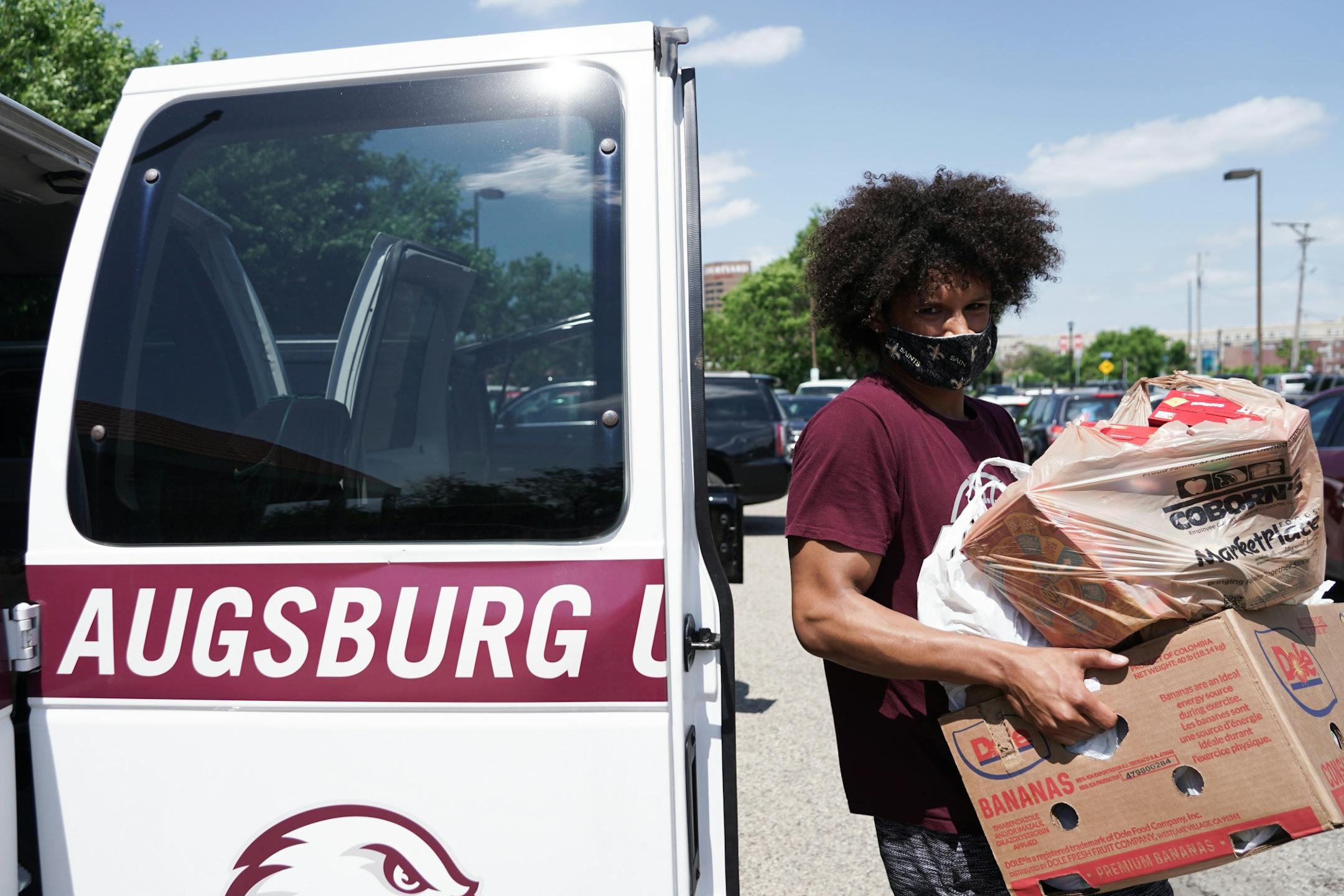 Devon Hannah and his Augsburg basketball teammates shuttled donations to the Brian Coyle Center in Cedar-Riverside.