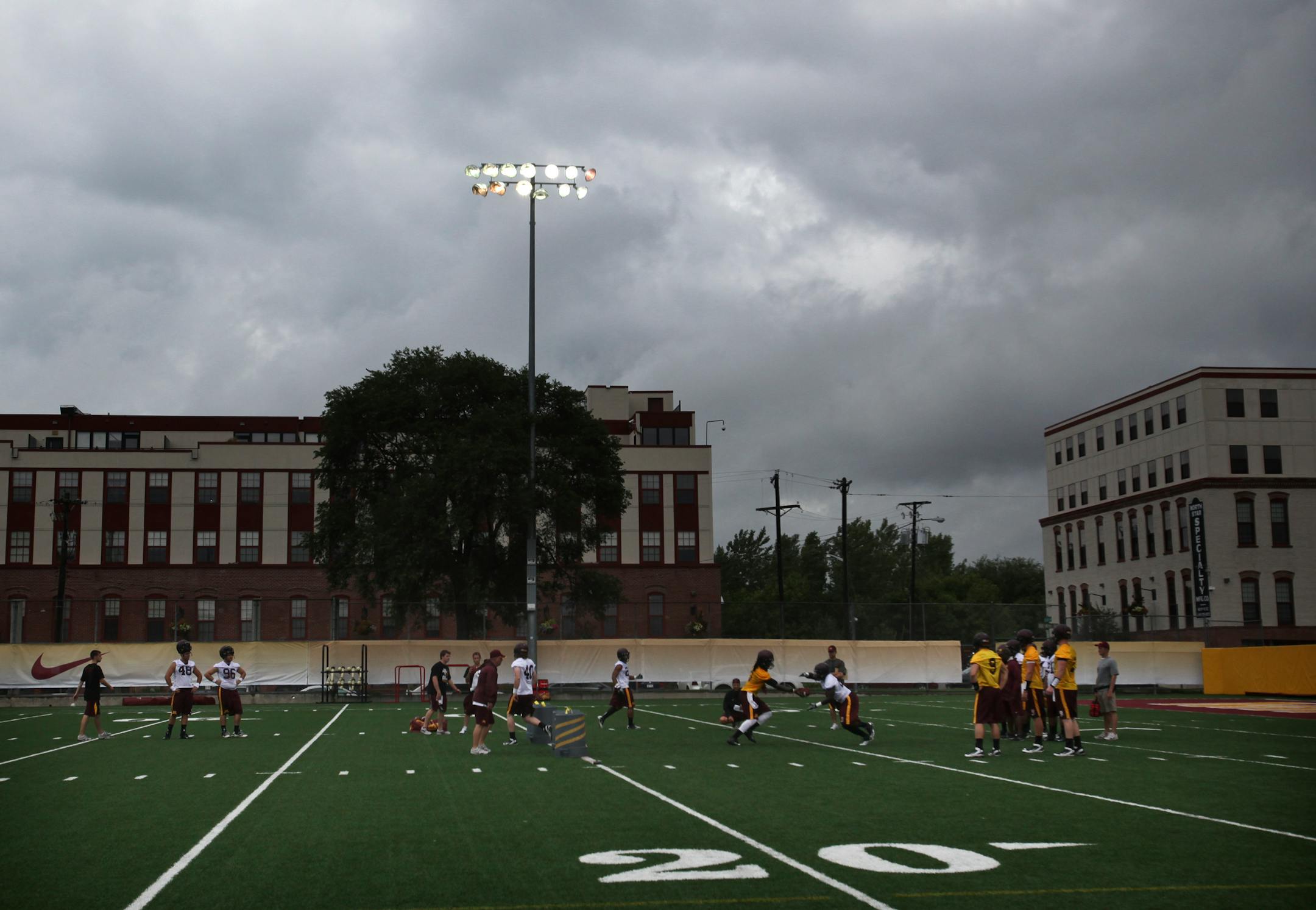 Under grey, rainy skies, the University of Minnesota football team went through their first day of practice at the U of M football complex Saturday, Aug. 4, 2012
