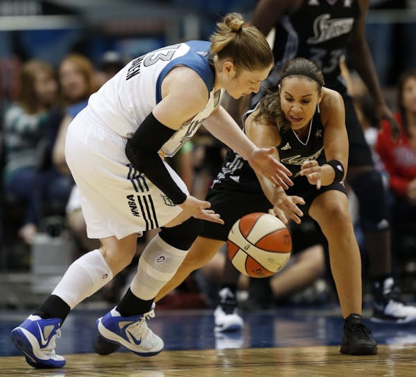 Lindsay Whalen(13) and Becky Hammon(25) of the Silver Stars battle for a loose ball .