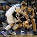 Lindsay Whalen(13) and Becky Hammon(25) of the Silver Stars battle for a loose ball .