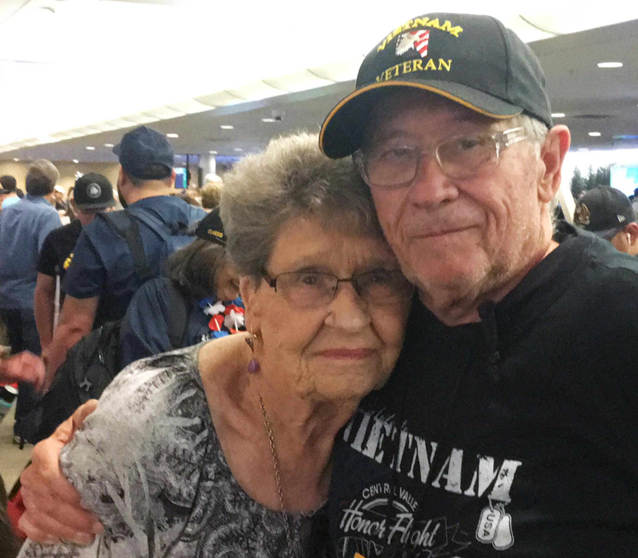 John Walker, 68, and his mother Carolyn, 90, of Visalia, hug each other after John Walker arrived Wednesday, May 15, 2019, from a three-day trip to Washington, D.C. war memorials as part of the 19th Central Valley Honor Flight. Walker is an Air Force veteran. (Cresencio Rodriguez-Delgado/Fresno Bee/TNS) ORG XMIT: 1317740 ORG XMIT: MIN1905170338056987