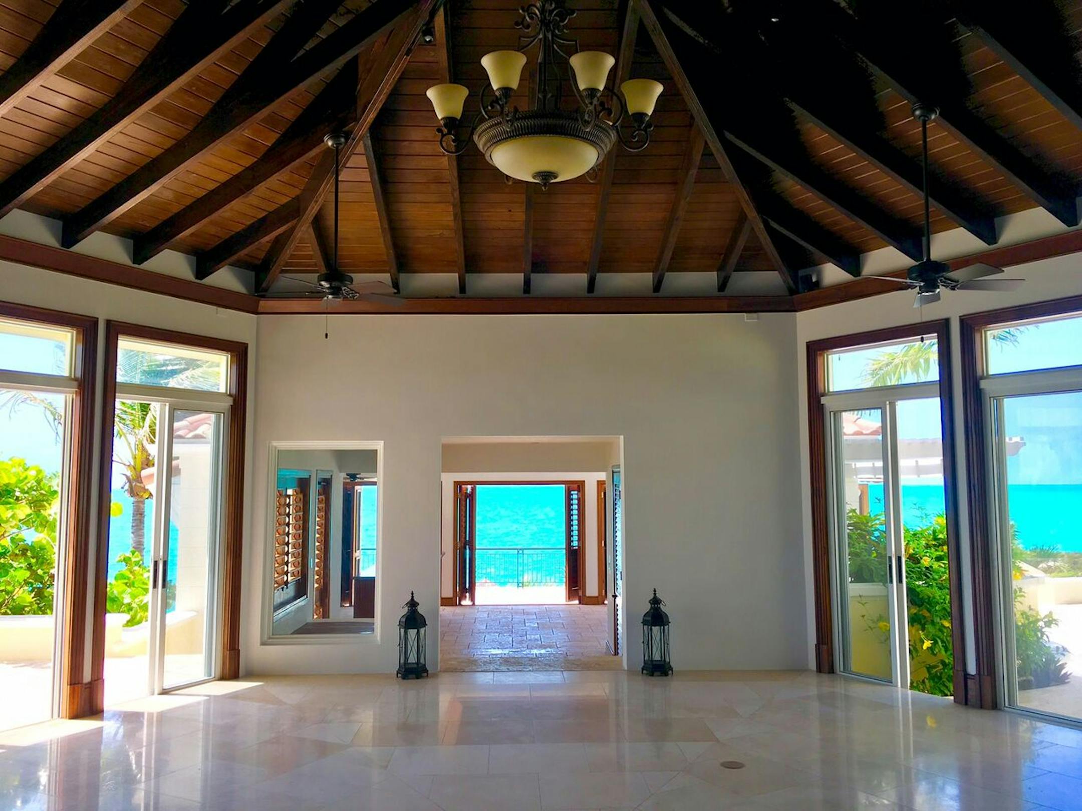 Sliding patio doors provide expansive views of the surrounding ocean.
