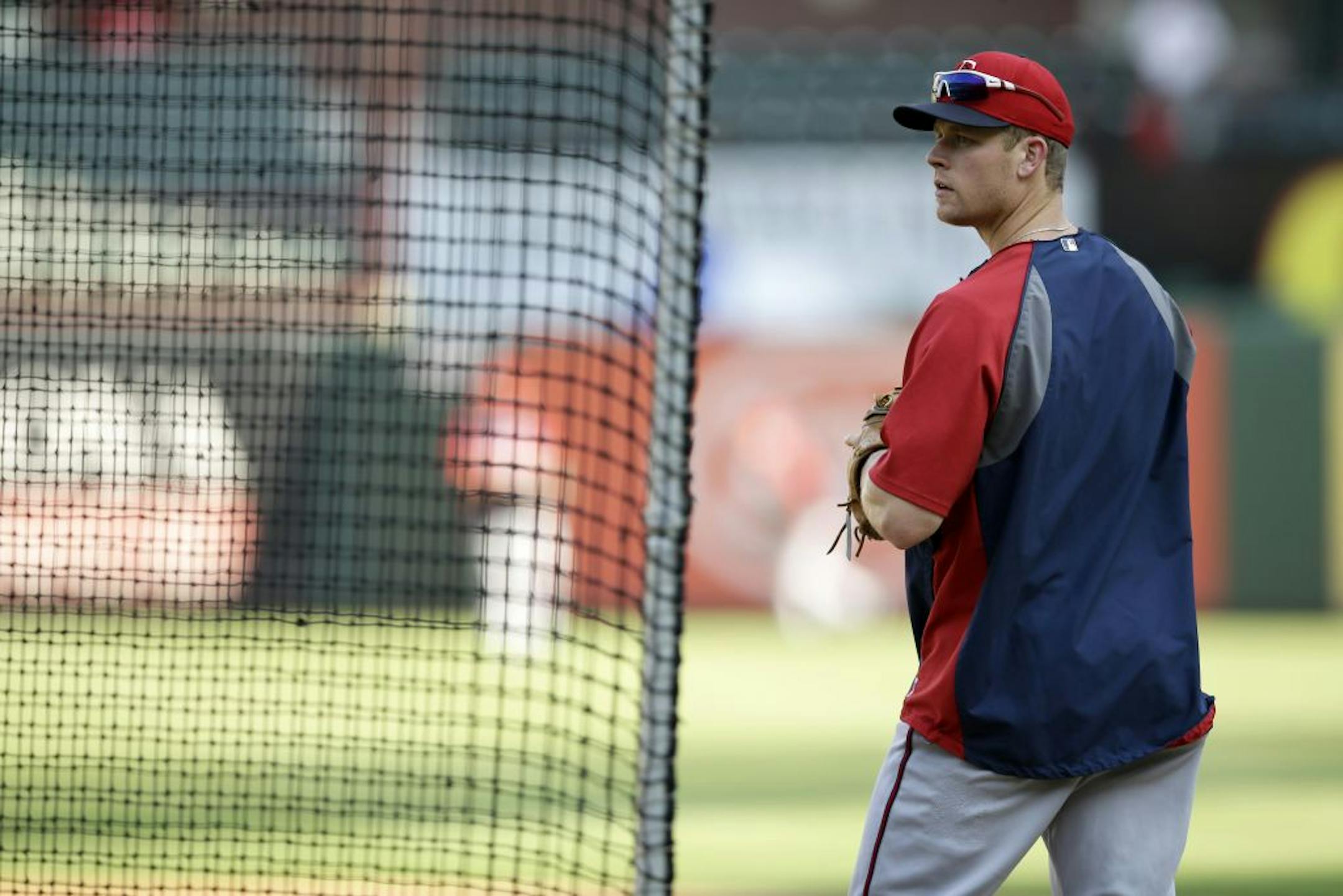 Minnesota Twins first baseman Justin Morneau takes fielding practice before a baseball game against the Texas Rangers, Friday, Aug. 30, 2013, in Arlington, Texas. The Twins won 3-2.