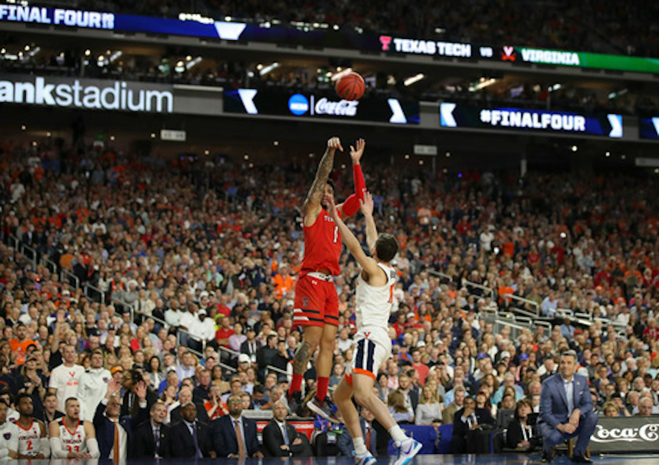 Texas Tech guard Brandone Francis (1) shoots over Virginia Cavaliers guard Ty Jerome (11) during the first half of the NCAA Championship game Monday, April 8, 2019 at U.S. Bank Stadium in Minneapolis, Minn. (Jerry Holt/Minneapolis Star Tribune/TNS)  ORG XMIT: 1298176