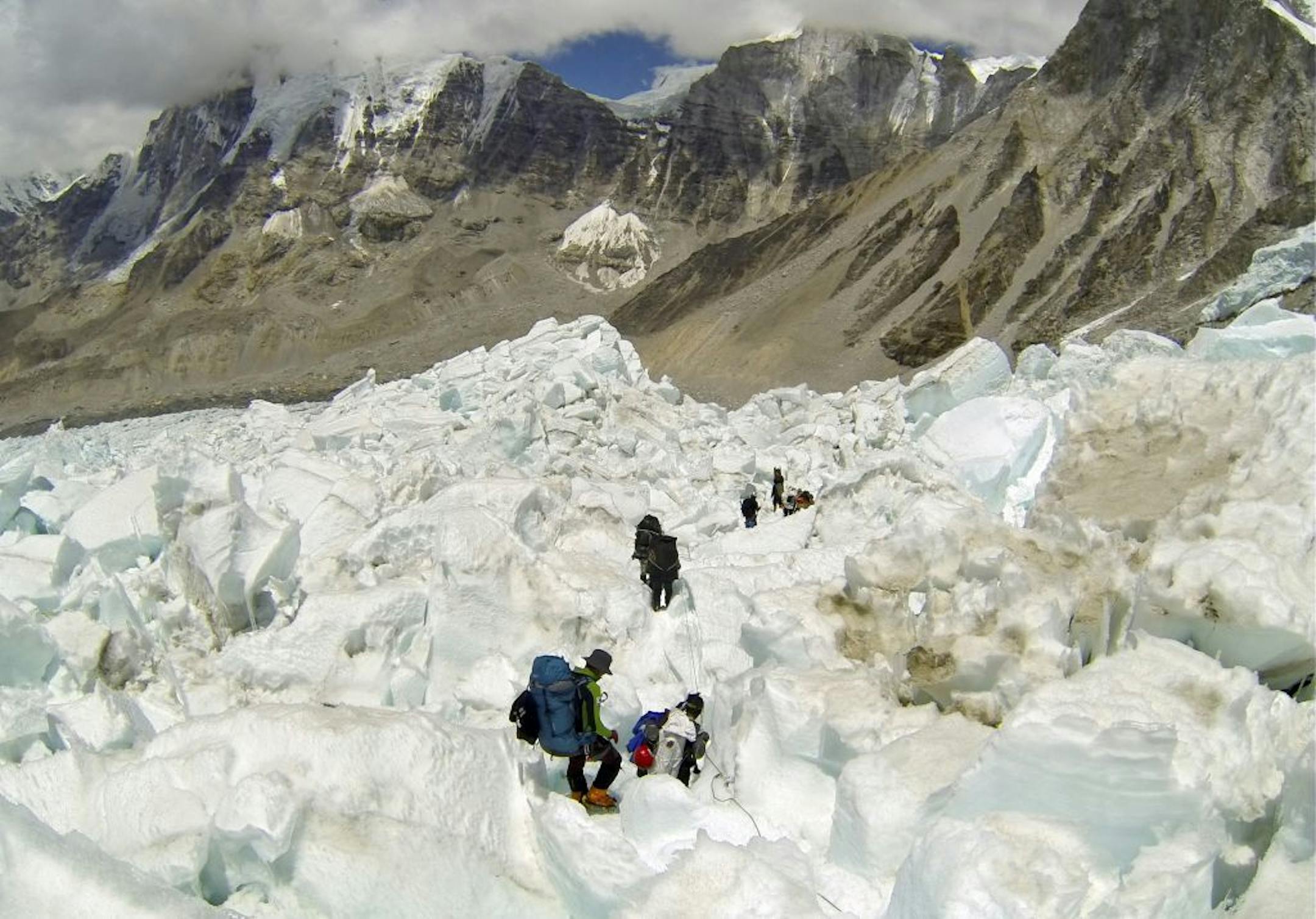 An avalanche in the Khumbu Icefall on Mount Everest, shown in the May 22, 2013 photo, killed 16 Sherpas and led dozens of their colleagues to walk off the mountain.