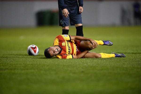 Fort Lauderdale Strikers forward Matheus Carvalho (11) rolled on the ground in pain after being gripped up by a United player in the second half Satur