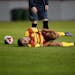 Fort Lauderdale Strikers forward Matheus Carvalho (11) rolled on the ground in pain after being gripped up by a United player in the second half Satur