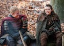 This image released by HBO shows Ed Sheeran, left, and Maisie Williams in a scene from "Game of Thrones." Sheeran appeared as a Lannister soldier lead