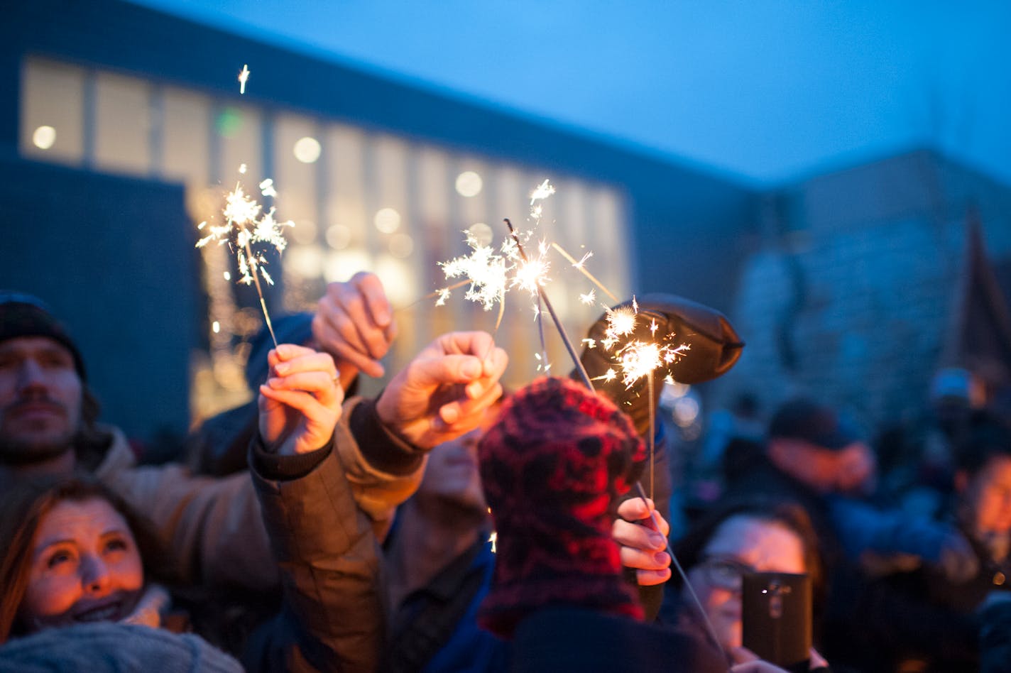 The crowd lights their sparklers from one another at the Winter Solstice celebration at the American Swedish Institute on Dec. 22, 2015. ] Photo by Leslie Plesser • Special to the Star Tribune