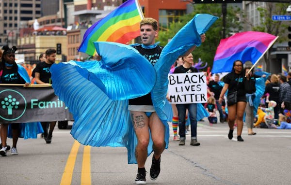 Brandon Waters led the Family Tree Clinic group at the 2017 Twin Cities Pride march. About 60 percent of the St. Paul clinic's 4,500 patients are from
