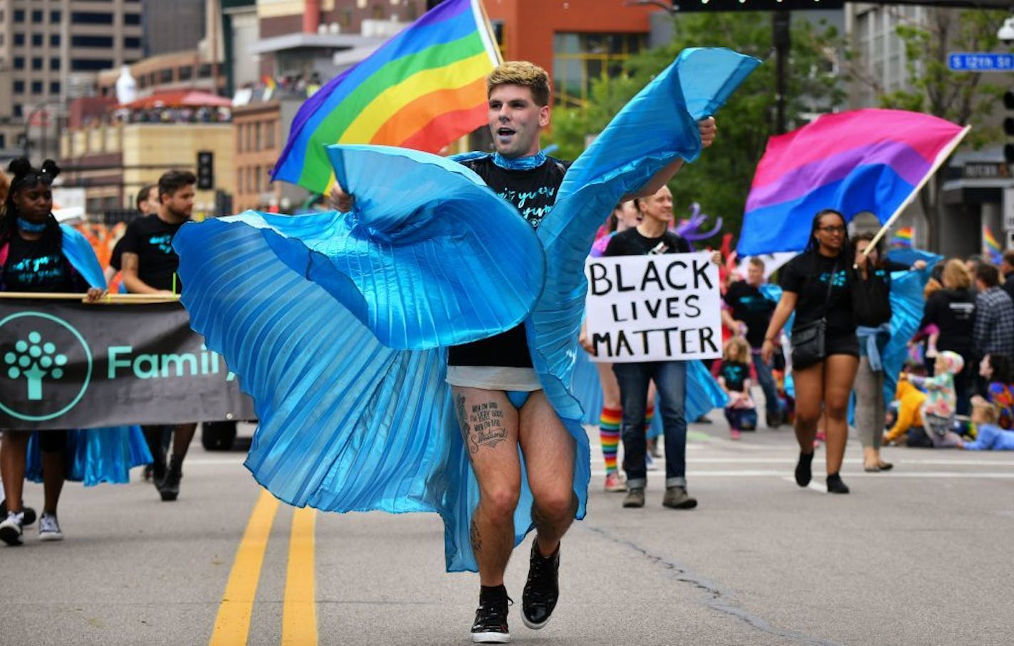 Brandon Waters led the Family Tree Clinic group at the 2017 Twin Cities Pride march. About 60 percent of the St. Paul clinic's 4,500 patients are from the LGBTQ community.