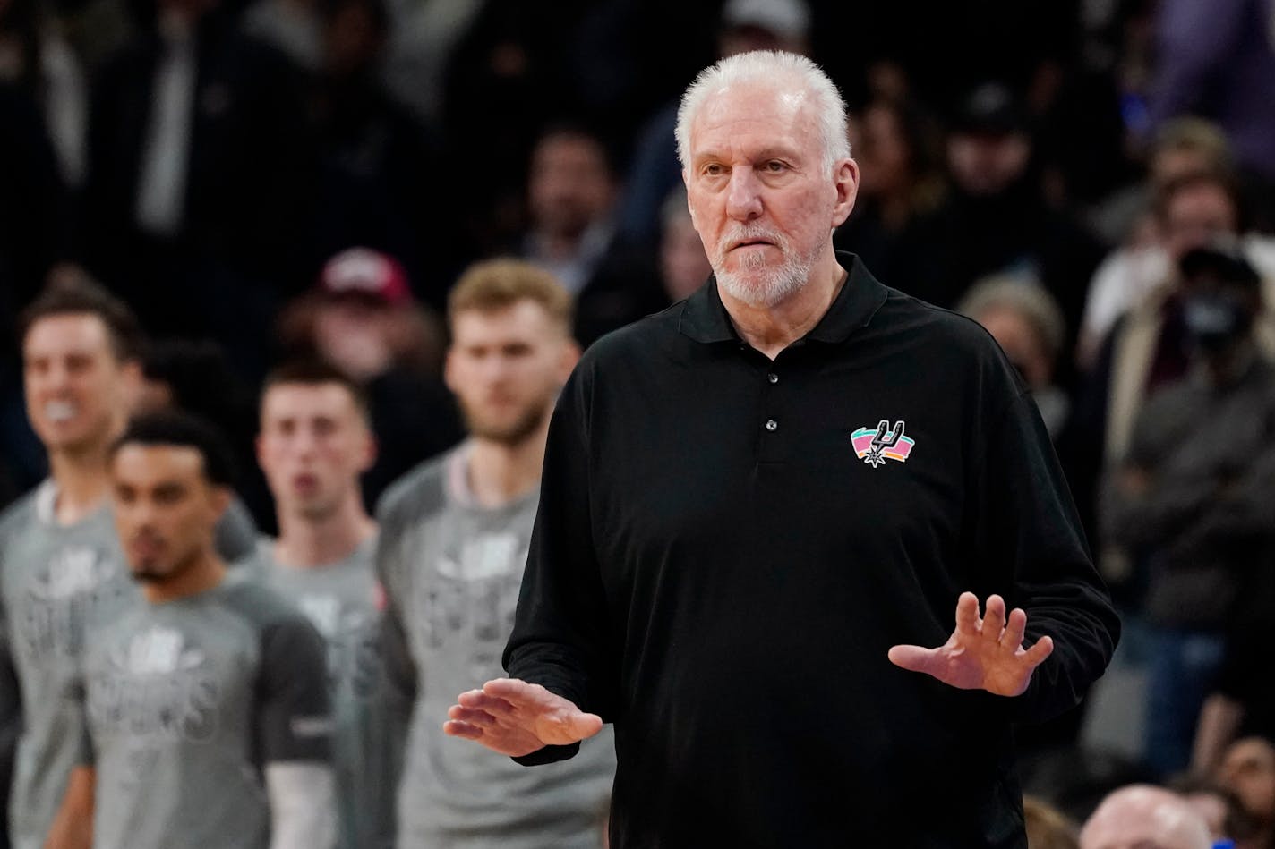 San Antonio Spurs head coach Gregg Popovich signals to his players during the second half of an NBA basketball game against the Utah Jazz, Friday, March 11, 2022, in San Antonio. The Spurs won, making Popovich the all-time winningest coach in NBA regular-season history. (AP Photo/Eric Gay)