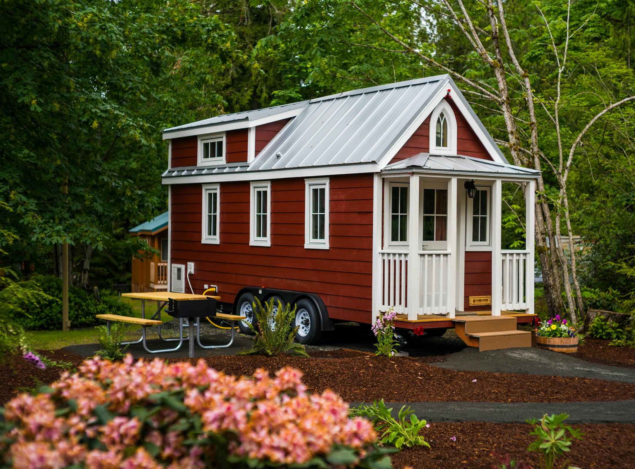 -- PHOTO MOVED IN ADVANCE AND NOT FOR USE - ONLINE OR IN PRINT - BEFORE MARCH 12, 2017. -- In an undated handout photo, the Scarlett, one of a few designs for short-stay rentals at a campground in Oregon. Small rooms are in the DNA of a number of new hotel brands, including Moxy Hotels from Marriott and Vib from Best Western, that are chasing millennial travelers. Now house rentals are shrinking too with the rise of the tiny-house hotel. (Mount Hood Tiny House Village via The New York Times) --