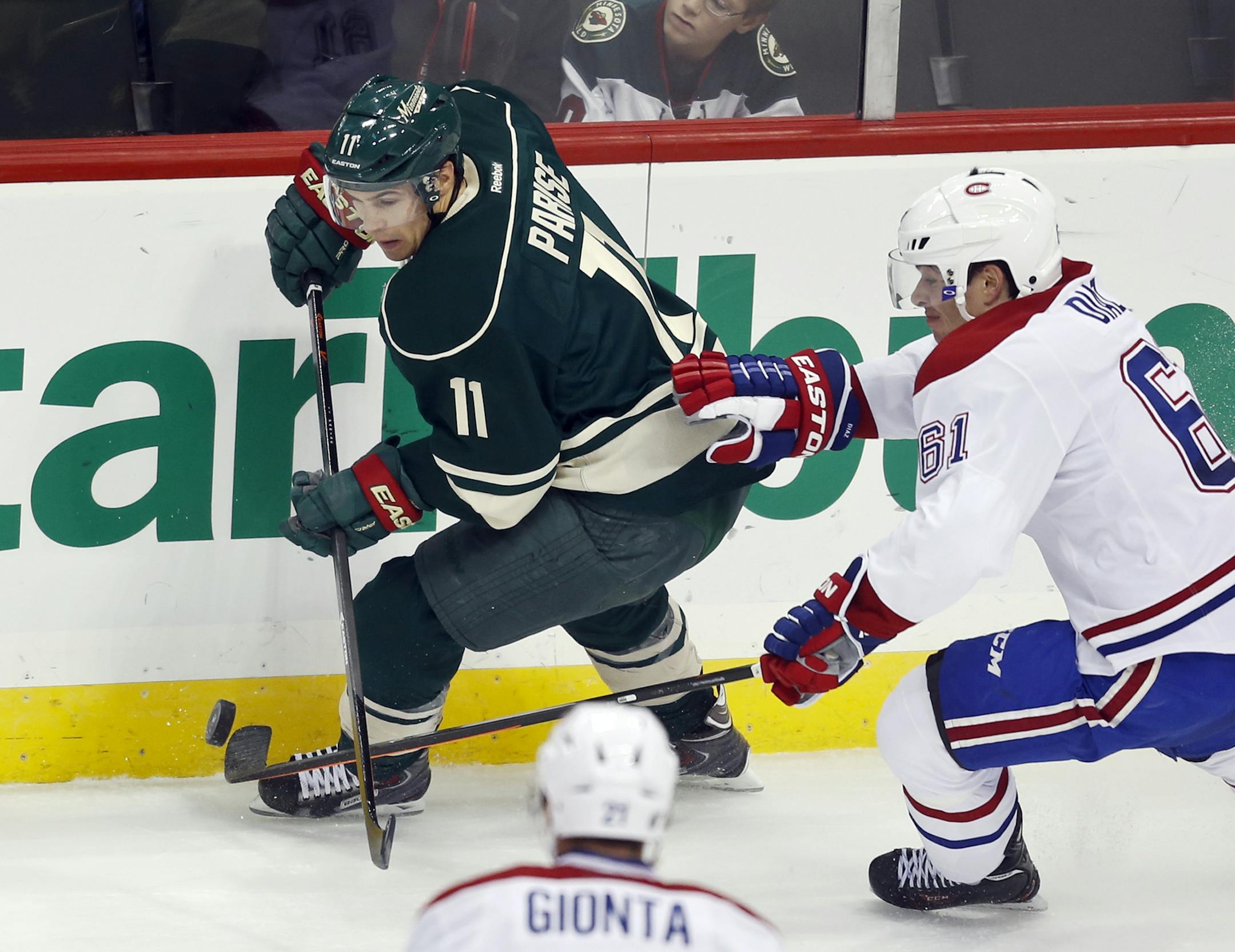 Montreal's Raphael Diaz (61) chases the Minnesota Wild's Zach Parise (11) during first period action Friday, Nov. 1, 2013, at the Xcel Energy Center in St. Paul, MN.](DAVID JOLES/STARTRIBUNE) djoles@startribune.com Montreal Canadians and the Minnesota Wild in NHL Hockey Friday, Nov. 1, 2013, at the Xcel Energy Center in St. Paul, MN.