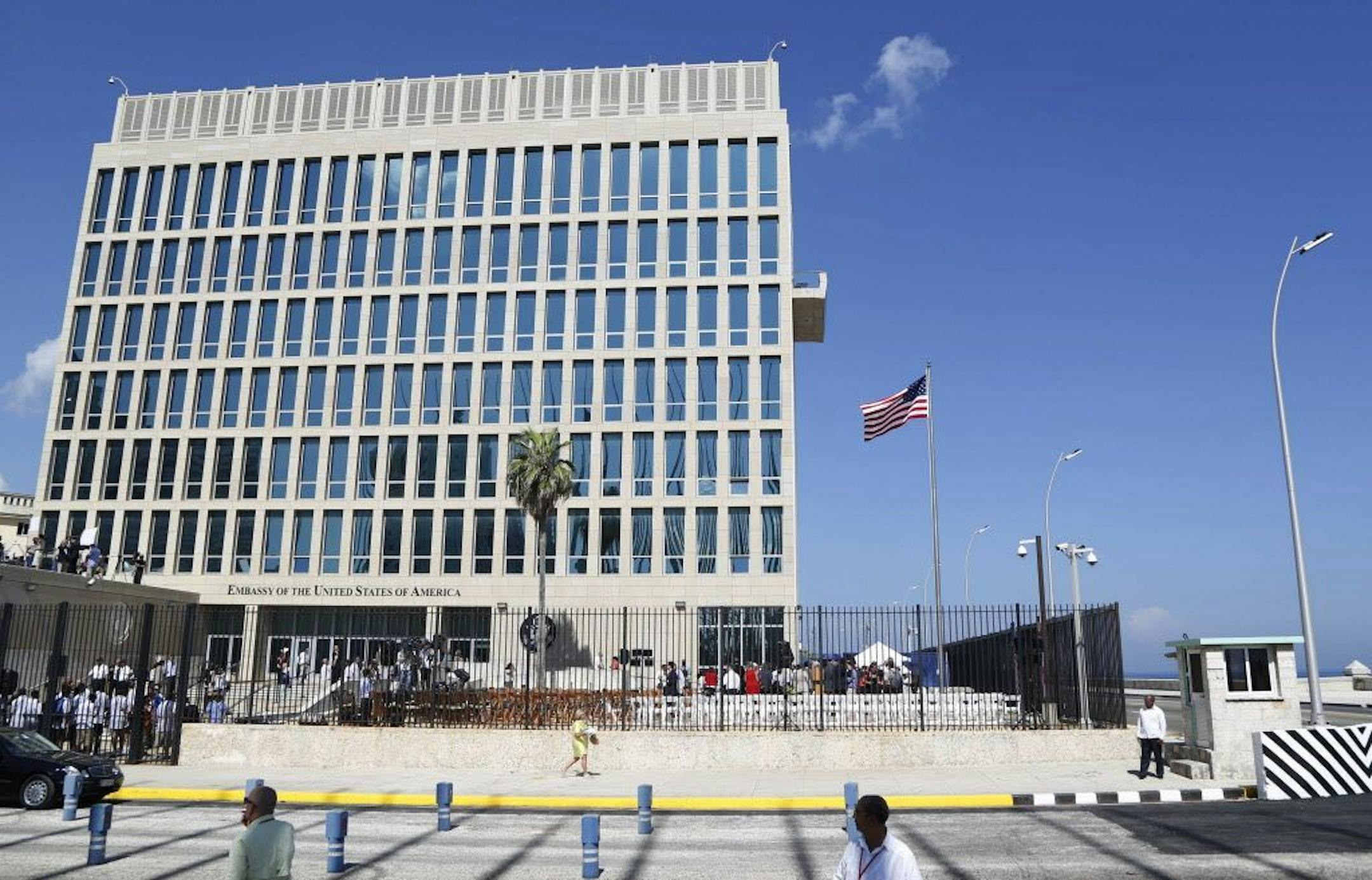 A U.S. flag flies at the U.S. Embassy in Havana, Cuba. Senior U.S. officials say the United States is pulling roughly 60 percent of its staff out of Cuba and warning American travelers not to visit due to "specific attacks" that have harmed U.S. diplomats.