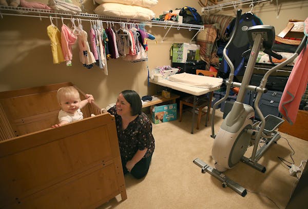 Sue Boxrud played with her daughter Lillie, 1, in her makeshift nursery, also a closet, Monday, May 11, 2015 in Ham Lake, MN. ] (ELIZABETH FLORES/STAR