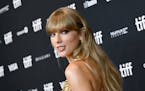 FILE - Taylor Swift attends an in conversation with Taylor Swift event at the Toronto International Film Festival on Sept. 9, 2022. Swift's latest alb