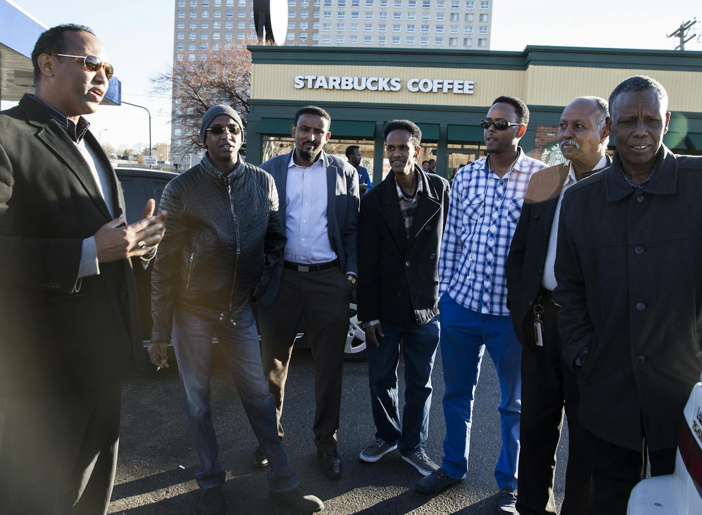 A group of Somali men discuss politics outside a Starbucks. ] (Leila Navidi/Star Tribune) leila.navidi@startribune.com BACKGROUND INFORMATION: Reaction from the local Somali community to the election of Donald Trump as president at the Starbucks in the Cedar-Riverside neighborhood of Minneapolis on Wednesday, November 10, 2016.